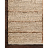 A tonal approach to Moroccan-inspired rugs, the Bodhi Ivory / Natural BOD-04 rug from Loloi is hand-woven of 100% jute. This rug features linear and braided details, creating natural variations that make a subtle yet striking statement for an entryway, living room, hallway or kitchen runner, or dining room. Amethyst Home provides interior design, new construction, custom furniture, and rugs for the Nashville metro area.