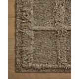 The Cassian Sage rug is a hand-woven wool and cotton area rug with an asymmetrical gridded pattern and high-low texture. The rug’s higher, shaggy pile takes cues from Moroccan designs, while the neutral colors and natural materials make it a cozy addition to any space, especially living rooms and dens. Amethyst Home provides interior design, new home construction design consulting, vintage area rugs, and lighting in the Omaha metro area.