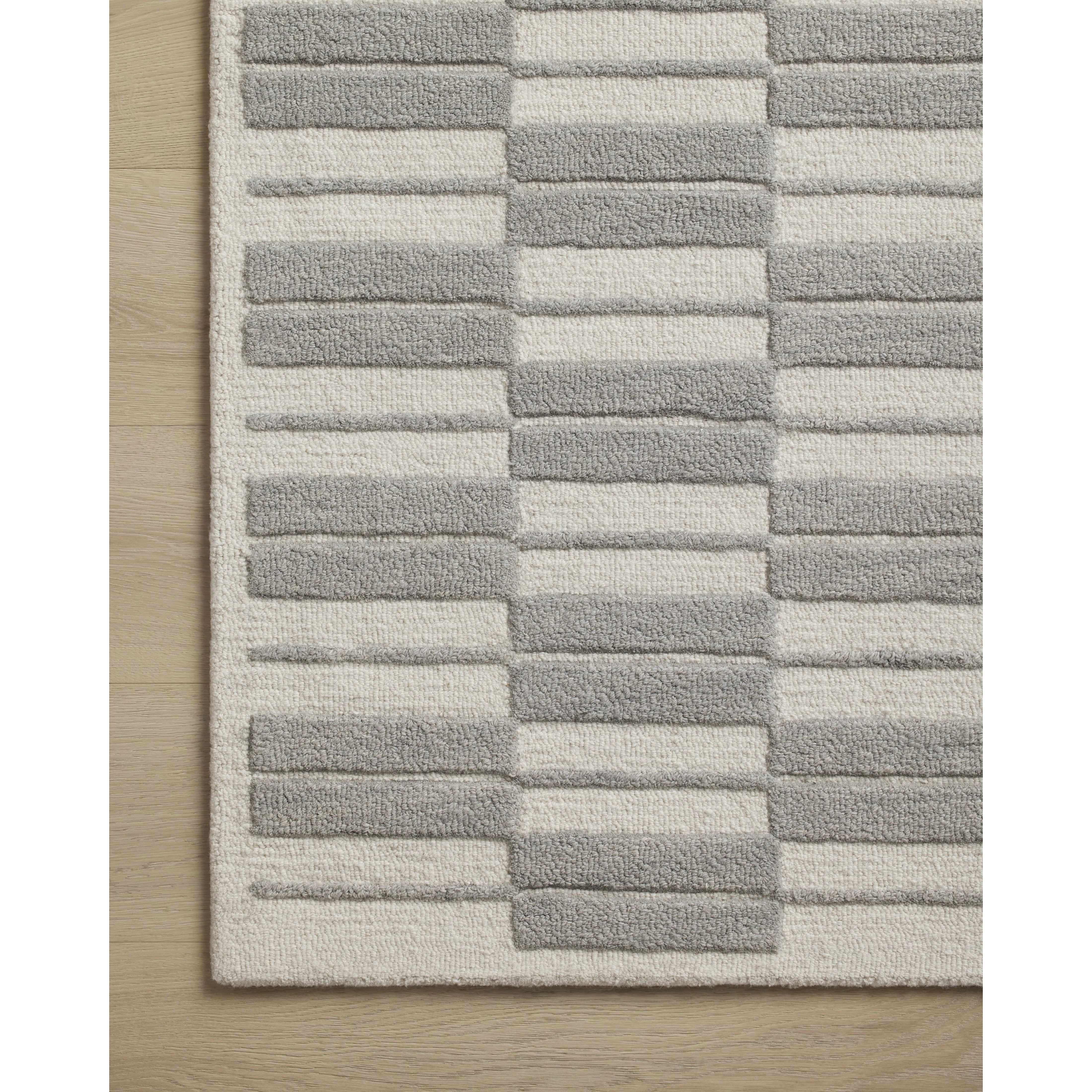 Featuring Chris Loves Julia x Loloi Bradley Ivory / Grey Rug by Loloi at Amethyst Home. The Bradley Collection from Chris Loves Julia x Loloi takes the classic striped rug to new heights. This hand-tufted, 100% wool collection features two-toned linear patterns with alternating high-low pile. Bradley is GoodWeave-certified, ensuring our commitment to ethical pr. Amethyst Home provides interior design, new home construction design consulting, vintage area rugs, and lighting in the Miami metro area.