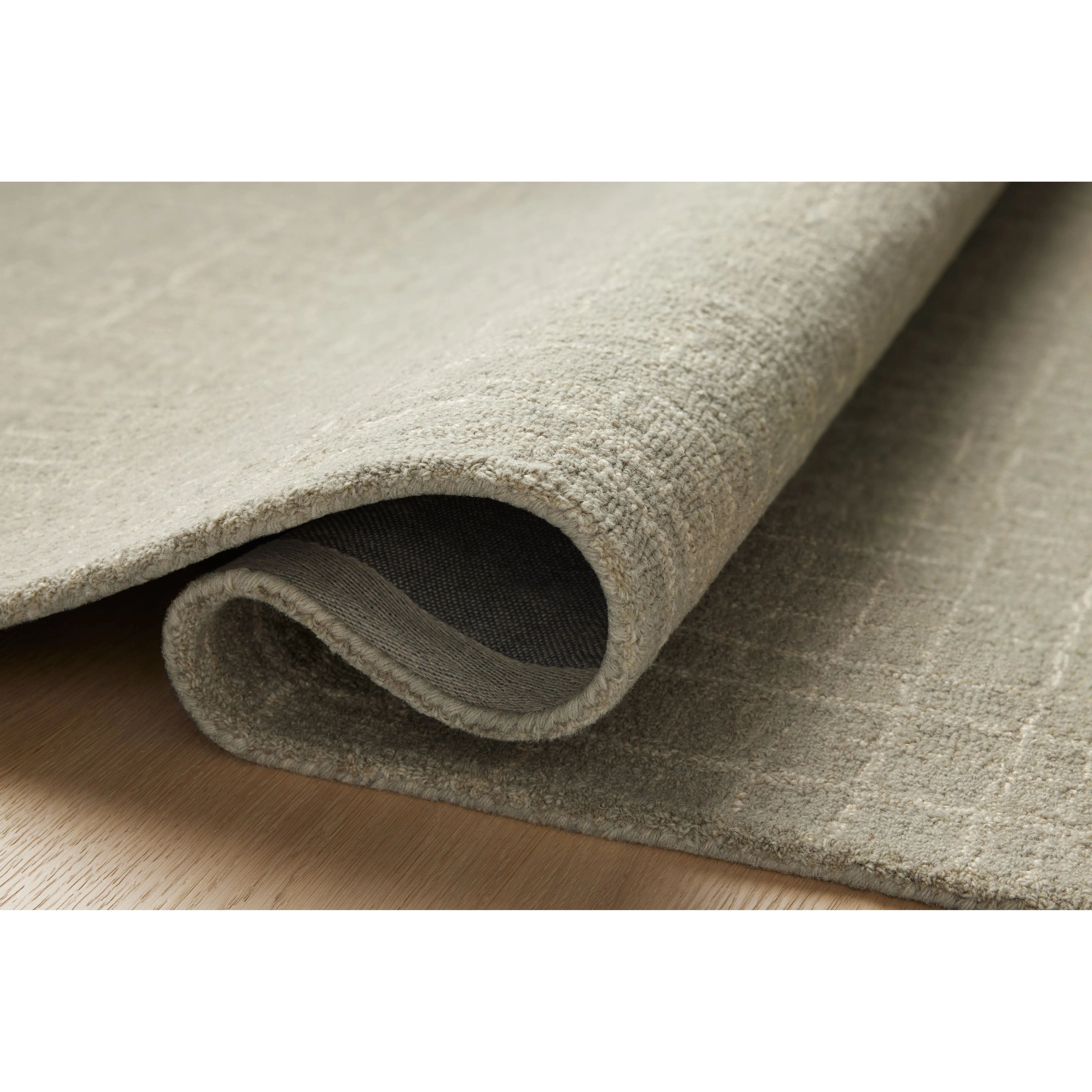 Featuring Chris Loves Julia x Loloi Polly Spa / Ivory Rug by Loloi at Amethyst Home. Hand-tufted of wool and jute pile, the Polly collection for Chris Loves Julia x Loloi brings a fresh take on modern yet classic designs. With striking gridded designs toned down by a neutral color palette, Polly is a timeless choice for any room. Polly is also GoodWeave certifi. Amethyst Home provides interior design, new home construction design consulting, vintage area rugs, and lighting in the Tampa metro area.