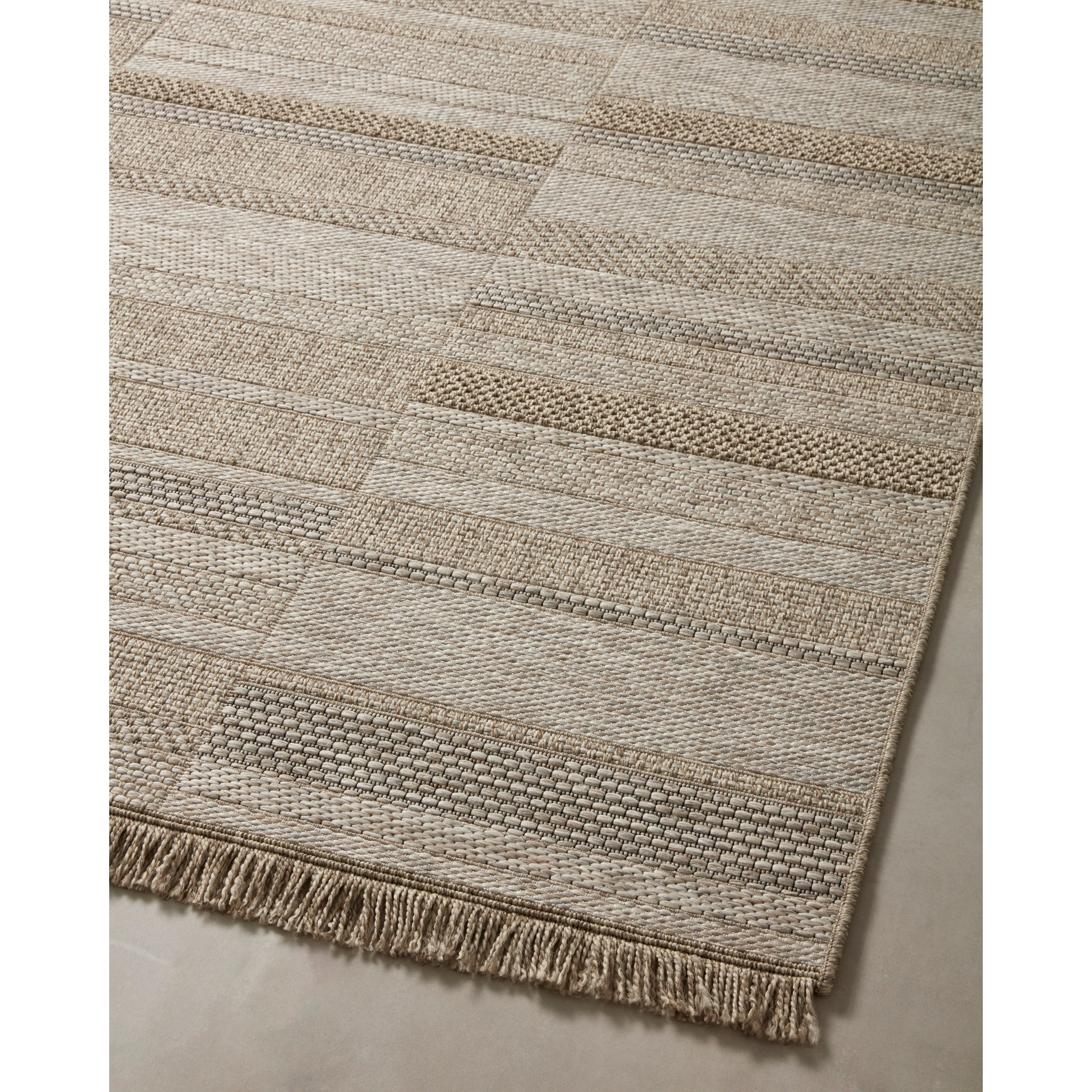 Featuring Dawn Natural DAW-03 Indoor/Outdoor Rug by Loloi at Amethyst Home. Made for sunny days ahead, the Dawn Collection is an indoor/outdoor rug that looks like a woven sisal rug but is power-loomed of 100% polypropylene, which makes it water- and mildew-resistant (so it's ready for rainy days ahead, too). Available in modern graphic patterns in tonal beige. Amethyst Home provides interior design, new home construction design consulting, vintage area rugs, and lighting in the Austin metro area.