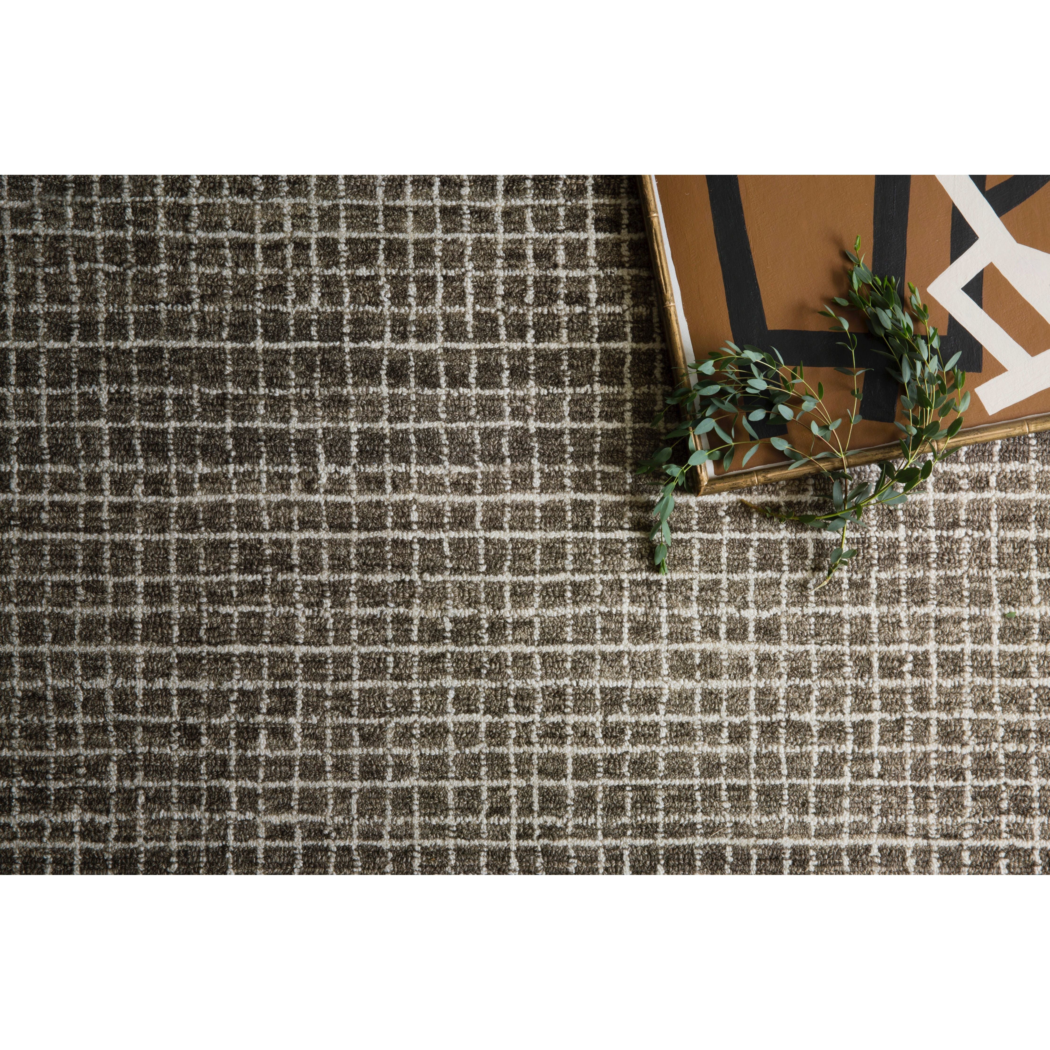 Inspired by textural watercolors, the Giana Charcoal GH-01 Rug from Loloi combines a relaxed grid with soft variations of grey and ivory for an effortless and sophisticated look. The rug is hooked of 100% wool by artisans adding a beautiful textural layer to your home bringing warmth and coziness to any room. Amethyst Home provides interior design, new construction, custom furniture, and rugs for the Austin, Dallas, and Houston metro area.