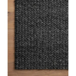 The Hendrick Charcoal Rug is a beautifully textured wool area rug with an elevated ease reminiscent of a cozy handmade sweater. The rug is very plush underfoot, making it equally welcome in bedrooms and living rooms. The hand-woven weave pattern adds dimension while the rug’s color palette is soft, neutral, and serene. Amethyst Home provides interior design, new construction, custom furniture, and area rugs in the Houston metro area.