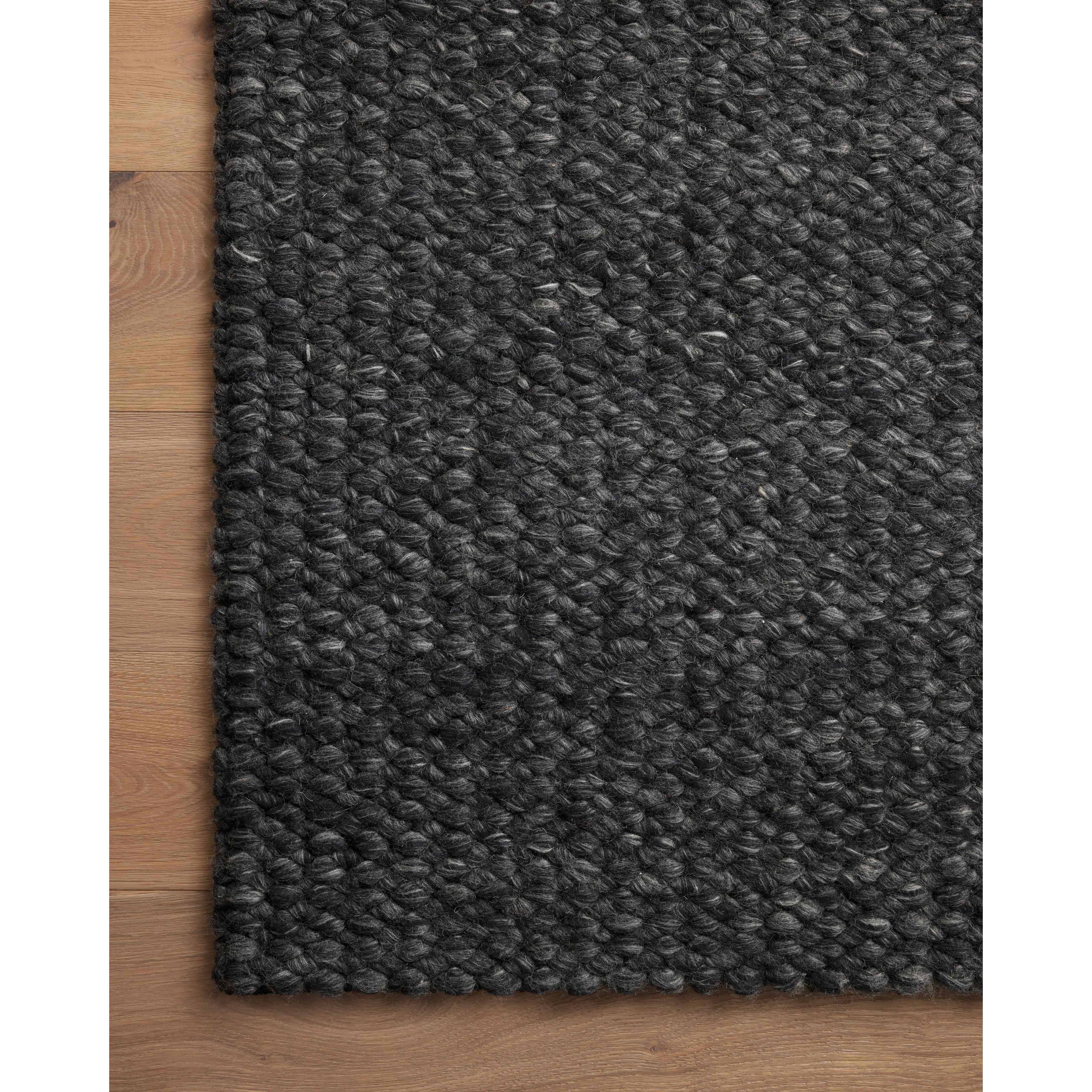 The Hendrick Charcoal Rug is a beautifully textured wool area rug with an elevated ease reminiscent of a cozy handmade sweater. The rug is very plush underfoot, making it equally welcome in bedrooms and living rooms. The hand-woven weave pattern adds dimension while the rug’s color palette is soft, neutral, and serene. Amethyst Home provides interior design, new construction, custom furniture, and area rugs in the Houston metro area.