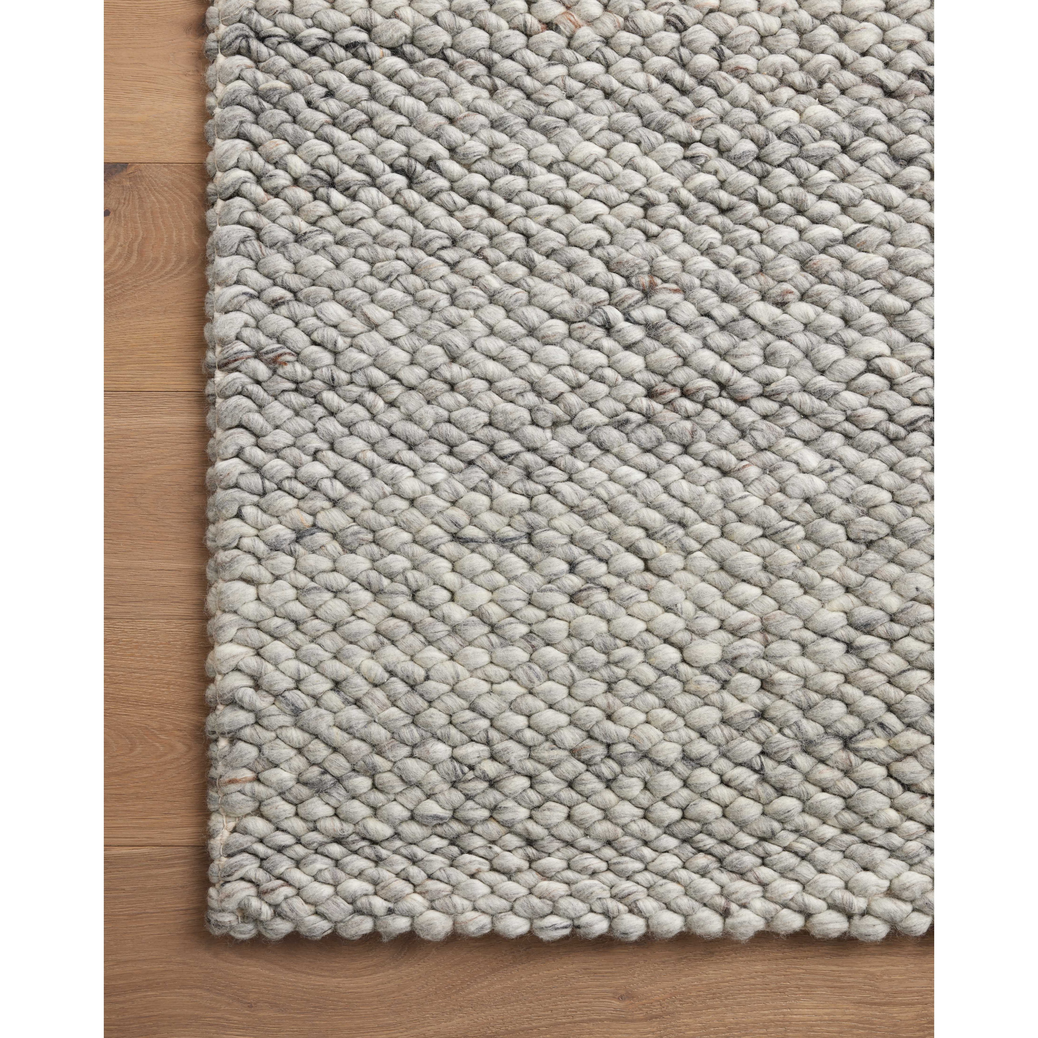 The Hendrick Grey Rug is a beautifully textured wool area rug with an elevated ease reminiscent of a cozy handmade sweater. The rug is very plush underfoot, making it equally welcome in bedrooms and living rooms. The hand-woven weave pattern adds dimension while the rug’s color palette is soft, neutral, and serene. Amethyst Home provides interior design, new construction, custom furniture, and area rugs in the Charlotte metro area.
