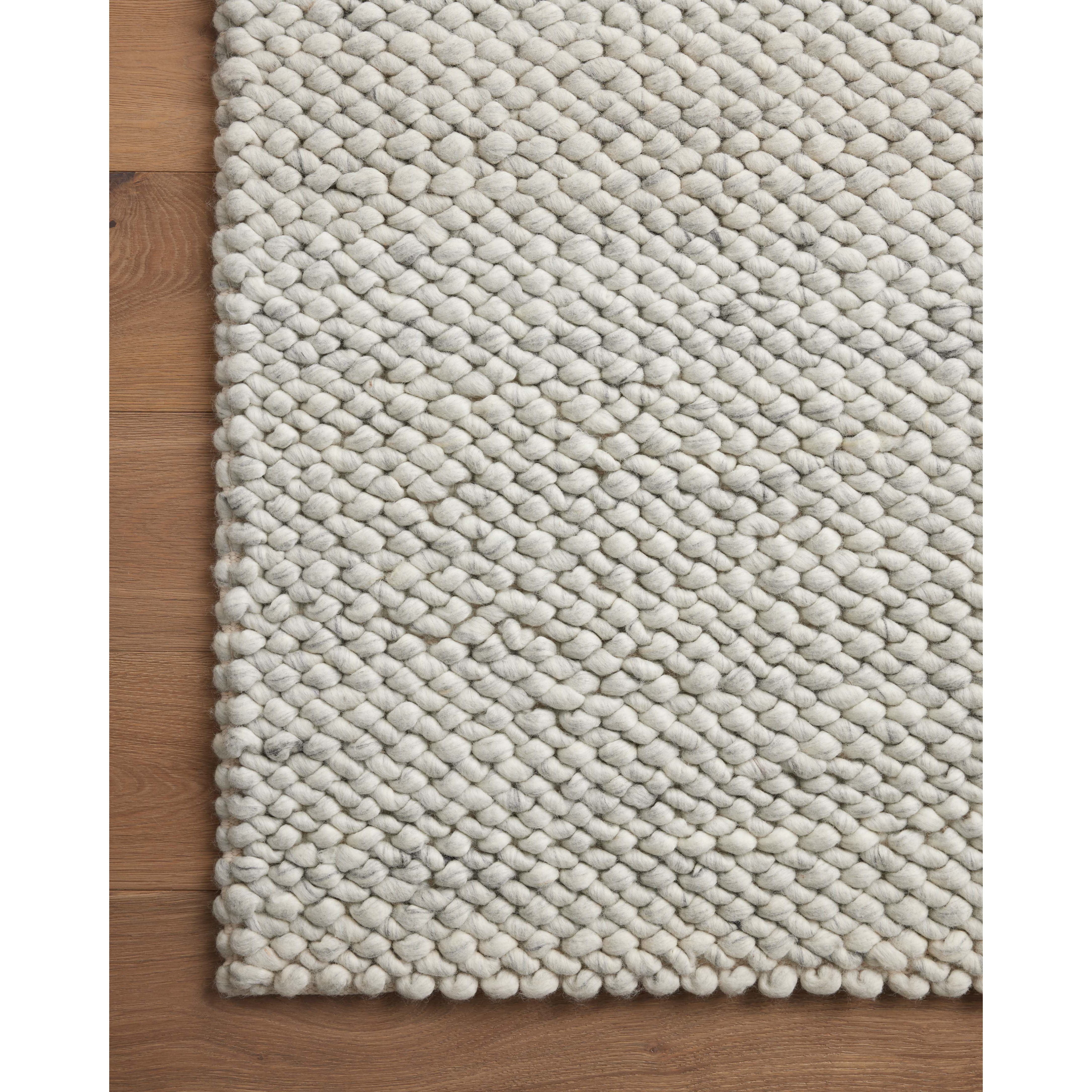 The Hendrick Ivory Rug is a beautifully textured wool area rug with an elevated ease reminiscent of a cozy handmade sweater. The rug is very plush underfoot, making it equally welcome in bedrooms and living rooms. The hand-woven weave pattern adds dimension while the rug’s color palette is soft, neutral, and serene. Amethyst Home provides interior design, new construction, custom furniture, and area rugs in the Seattle metro area.