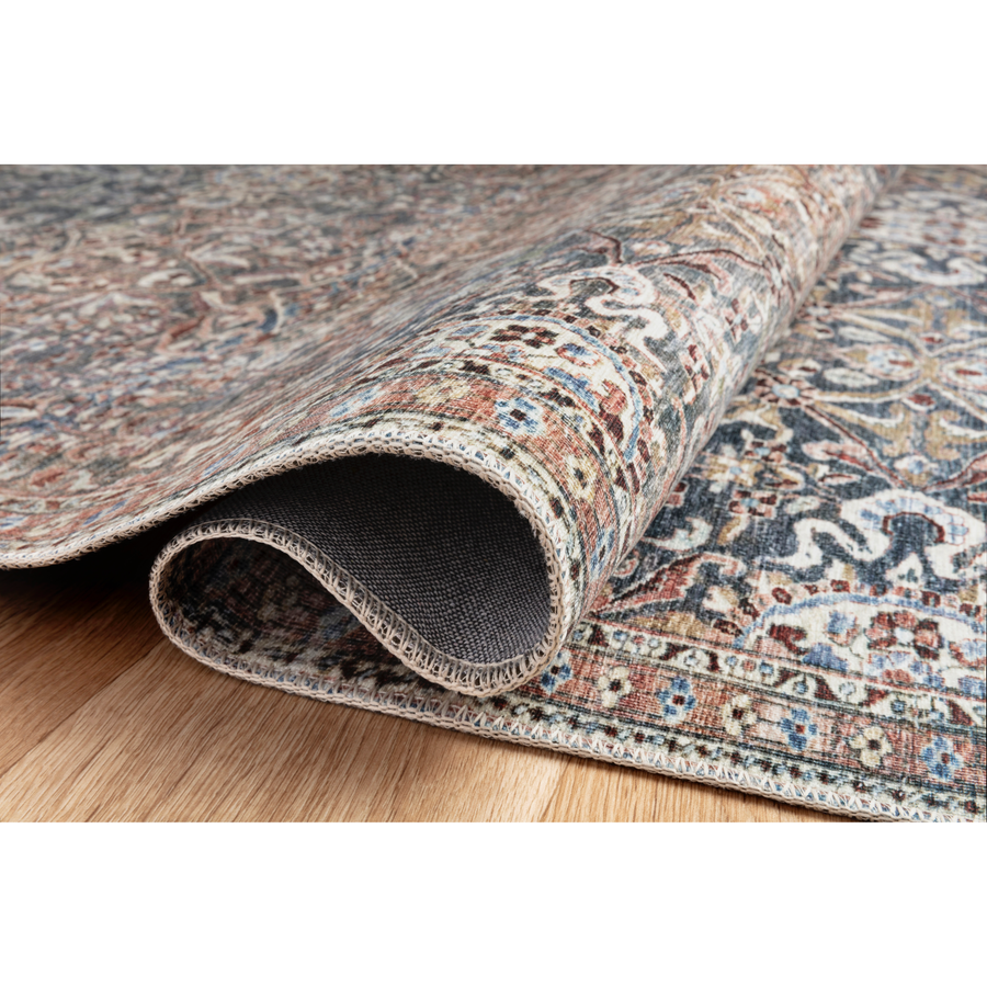 Durable, low pile, and soft underfoot, this rug is inspired by classic vintage and antique rugs. The Jules Chris Loves Julia Denim / Spice rug from Loloi features a beautiful vintage pattern and patina. The rug is easy to clean and maintain and perfect for living rooms, dining rooms, hallways, and kitchens!