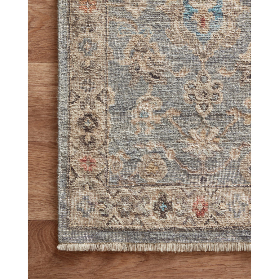 The Legacy Blue / Multi LZ-10 Rug from Loloi is hand-knotted, refined, yet versatile for hallways, living rooms, bedrooms, and extra large spaces. The Legacy rug is deliberately distressed and sheared down to an extra low pile of 100% wool, creating a patina usually only imparted through decades of wear. Amethyst Home provides interior design, new construction, custom furniture, and rugs for the Scottsdale metro area.