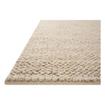 The Hendrick Natural Rug is a beautifully textured wool area rug with an elevated ease reminiscent of a cozy handmade sweater. The rug is very plush underfoot, making it equally welcome in bedrooms and living rooms. The hand-woven weave pattern adds dimension while the rug’s color palette is soft, neutral, and serene. Amethyst Home provides interior design, new construction, custom furniture, and area rugs in the Kansas City metro area.
