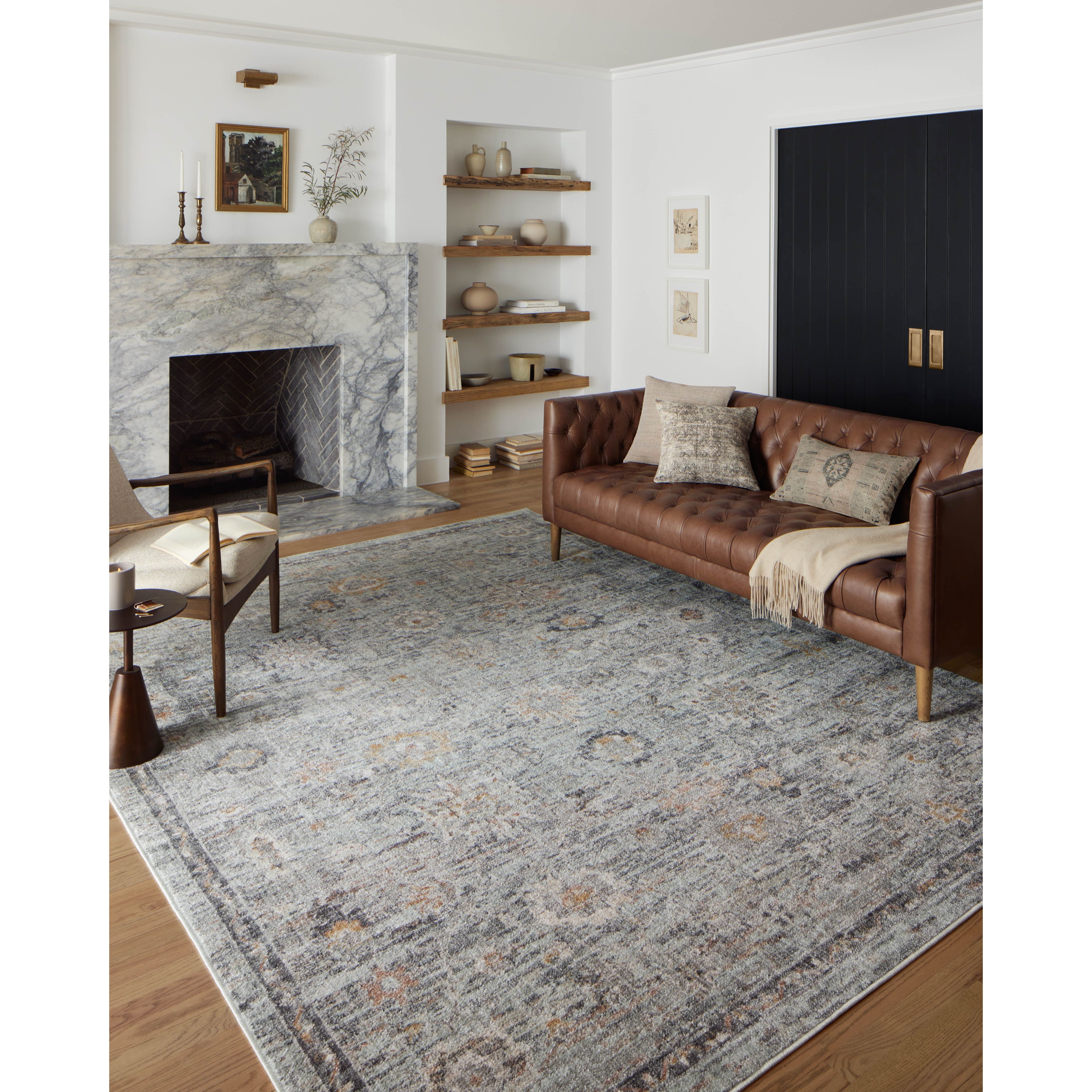 Inspired by antique Turkish Oushak carpets with large-scale motifs, the Monroe Sky / Gold Rug modernizes the traditional design in neutral palettes, many of which have black details that anchor the rug in the room. Monroe is power-loomed of 100% polypropylene for easy care and reliable durability. Amethyst Home provides interior design, new home construction design consulting, vintage area rugs, and lighting in the Houston metro area.