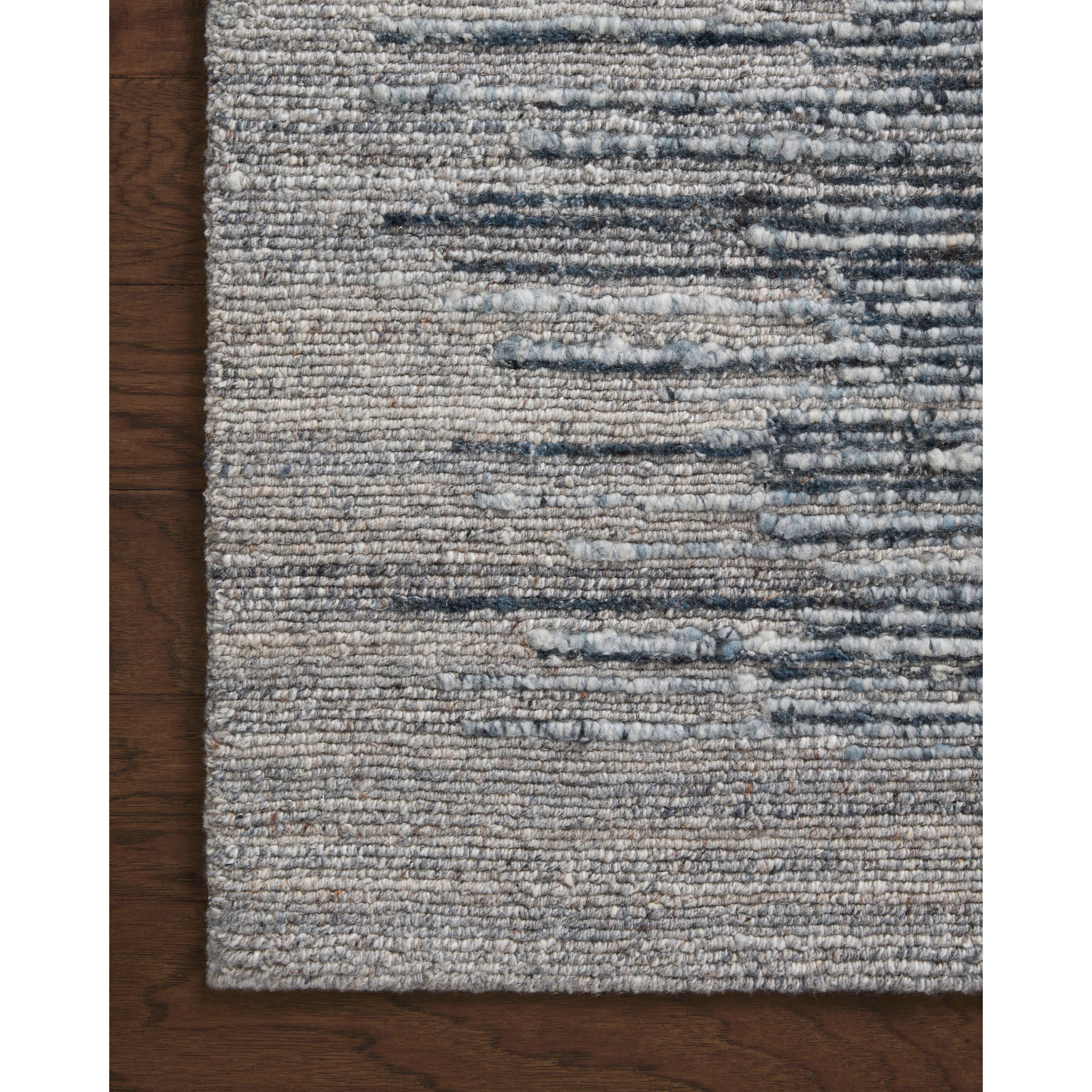 The Raquel Collection exemplifies what makes a hand-knotted rug so unique. Each area rug has a ribbed texture and subtle striping created by the artisan’s cut-and-loop technique. Raquel features an organic, asymmetrical linear pattern in an airy, neutral palette. Amethyst Home provides interior design, new home construction design consulting, vintage area rugs, and lighting in the Alpharetta metro area.