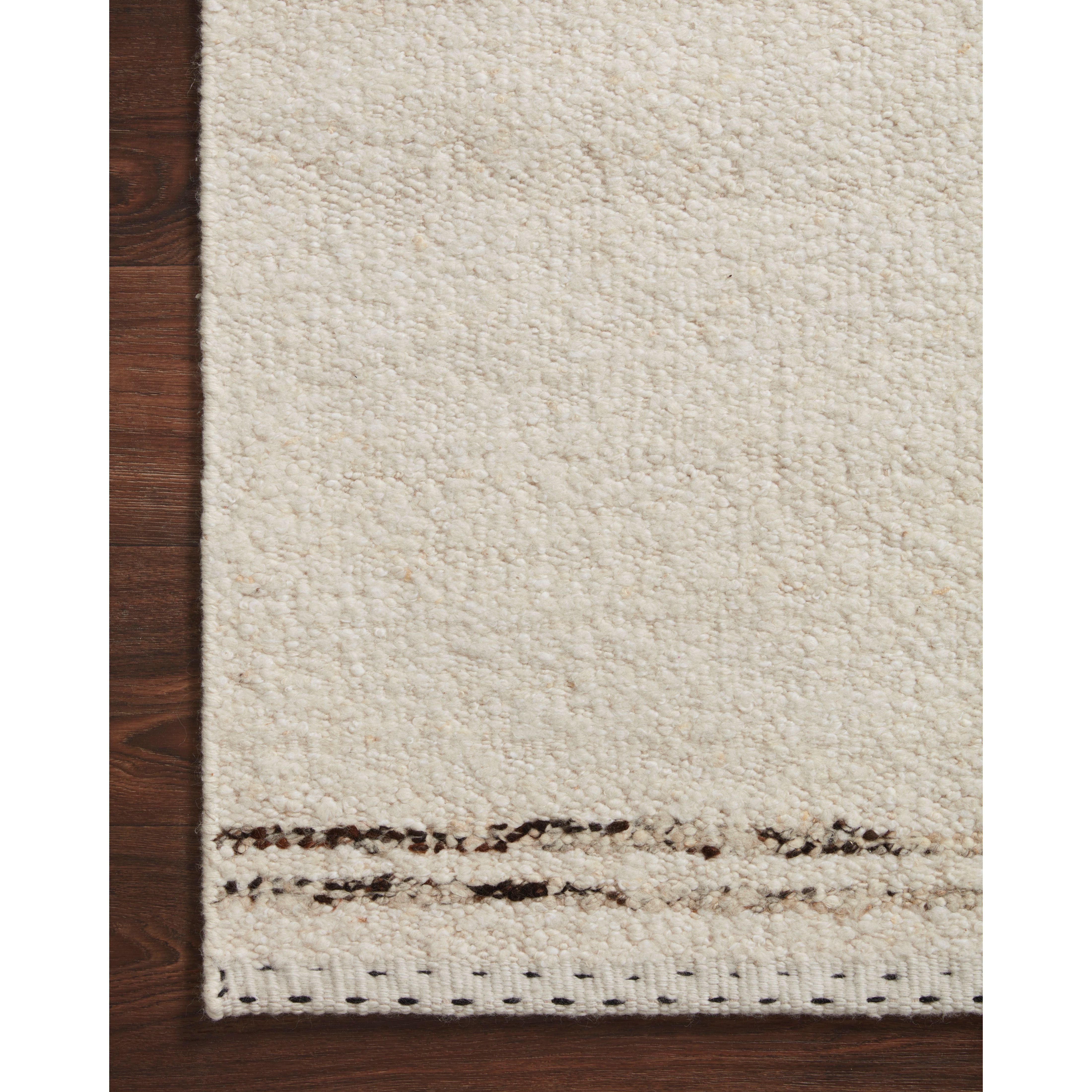 A perfect blend of refined and relaxed, the Roman Ivory / Granite ROM-03 rug from Loloi is hand woven of wool, cotton and viscose by skilled artisans. Designs with meticulously placed strokes elevate any area such as an entryway, living room, dining room, or bedroom. Each piece is finished with a unique stitched edge. Amethyst Home provides interior design, new construction, custom furniture, and rugs for the Des Moines and Cedar Rapids, Iowa metro area.