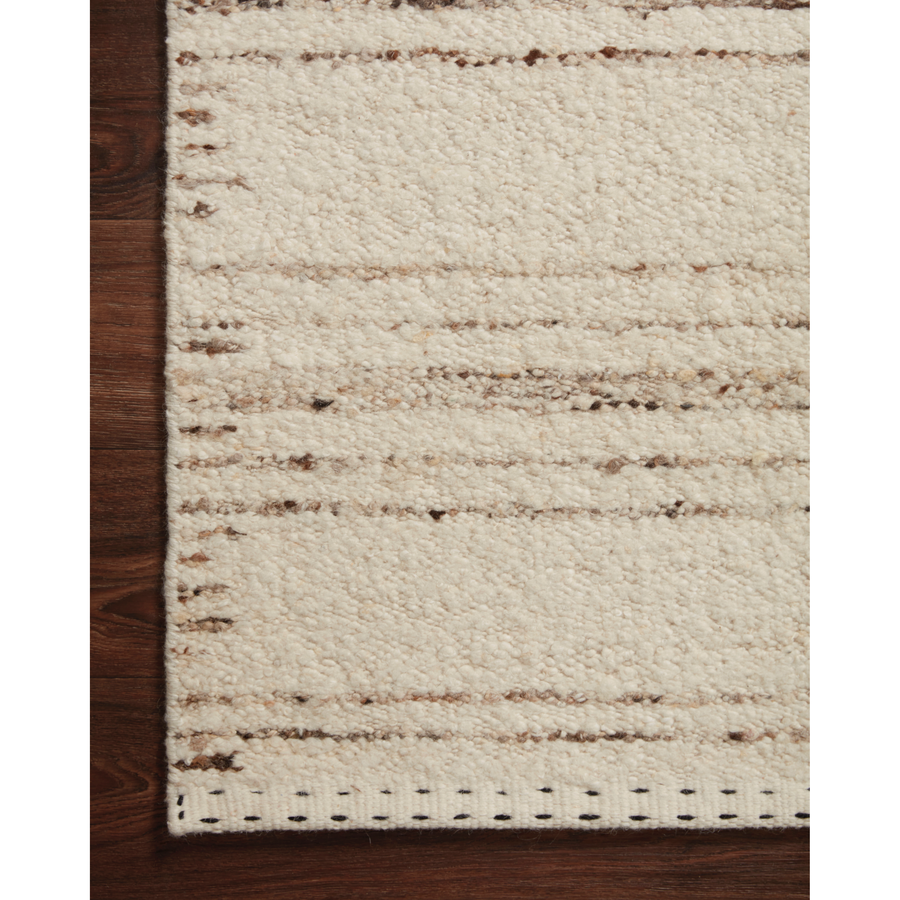 A perfect blend of refined and relaxed, the Roman Ivory / Pebble ROM-02 rug from Loloi is hand woven of wool, cotton and viscose by skilled artisans. Designs with meticulously placed strokes elevate any area such as an entryway, living room, dining room, or bedroom. Each piece is finished with a unique stitched edge. Amethyst Home provides interior design, new construction, custom furniture, and rugs for the Des Moines and Cedar Rapids, Iowa metro area.