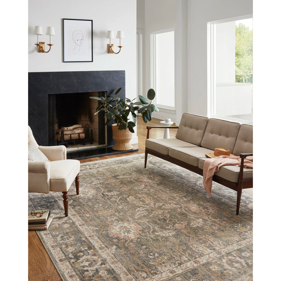 Durable, low pile, and soft underfoot, this rug is inspired by classic vintage and antique rugs. The Rosemarie Chris Loves Julia Sage / Blush ROE-01 rug from Loloi features a beautiful vintage pattern and patina. The rug is easy to clean, never sheds, and perfect for living rooms, dining rooms, hallways, and kitchens!