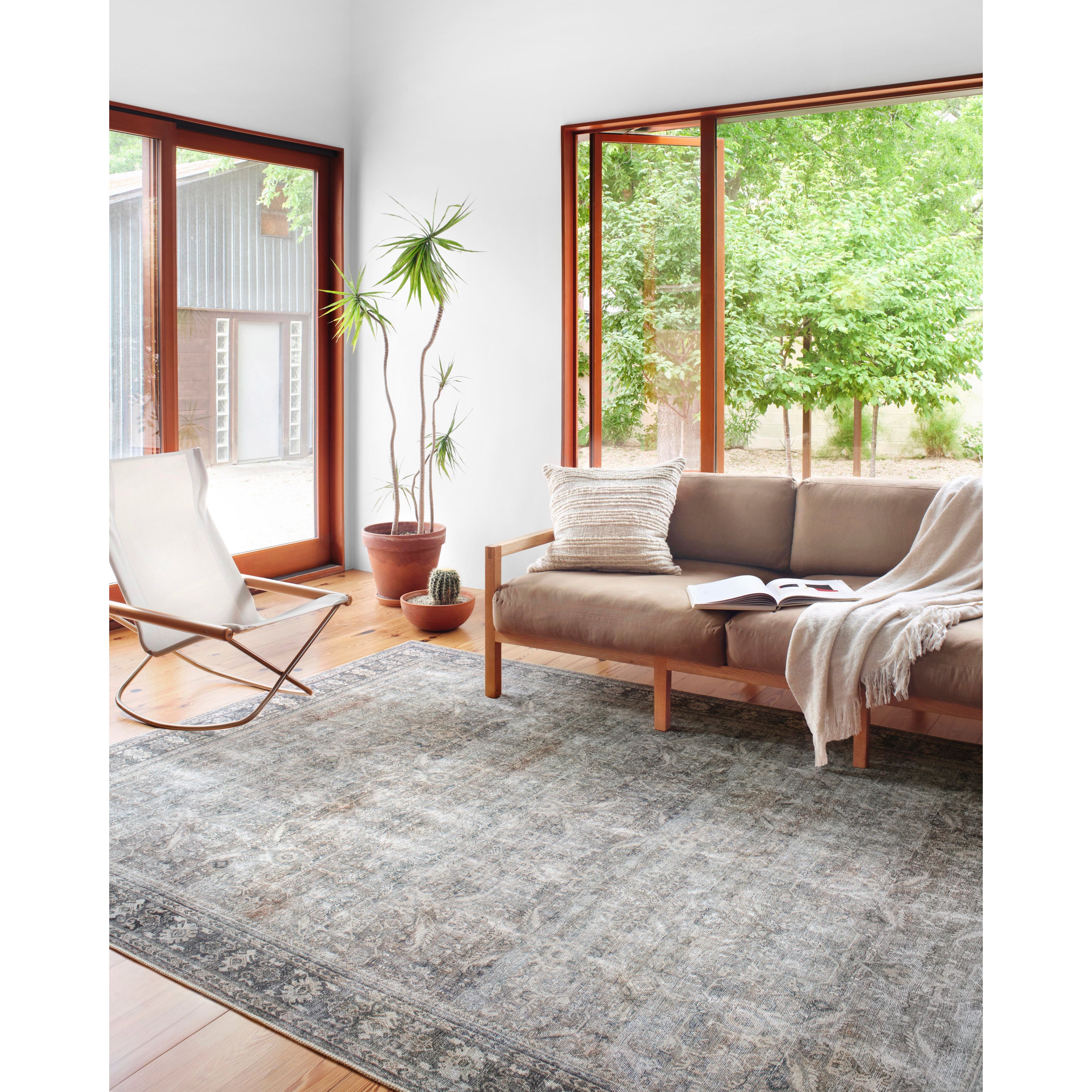The Wynter Grey / Charcoal WYN-07 area rug showcases a one-of-a-kind vintage or antique area rug look power-loomed of 100% polyester. This rug brings in tones of silver, blue, and tan. The rug is ideal for high traffic areas due to the rug's durability for living rooms, dining rooms, kitchens, hallways, and entryways. Amethyst Home provides interior design, new construction, custom furniture, and rugs for the Des Moines and Cedar Rapids metro area.