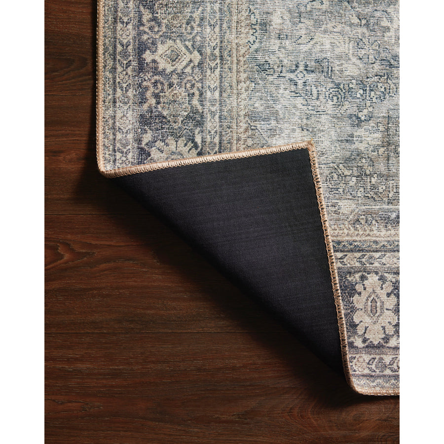The Wynter Grey / Charcoal WYN-07 area rug showcases a one-of-a-kind vintage or antique area rug look power-loomed of 100% polyester. This rug brings in tones of silver, blue, and tan. The rug is ideal for high traffic areas due to the rug's durability for living rooms, dining rooms, kitchens, hallways, and entryways. Amethyst Home provides interior design, new construction, custom furniture, and rugs for the Hudson Valley and New York metro area.