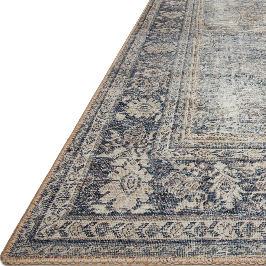 The Wynter Grey / Charcoal WYN-07 area rug showcases a one-of-a-kind vintage or antique area rug look power-loomed of 100% polyester. This rug brings in tones of silver, blue, and tan. The rug is ideal for high traffic areas due to the rug's durability for living rooms, dining rooms, kitchens, hallways, and entryways. Amethyst Home provides interior design, new construction, custom furniture, and rugs for the Kansas City metro area.