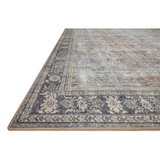 The Wynter Grey / Charcoal WYN-07 area rug showcases a one-of-a-kind vintage or antique area rug look power-loomed of 100% polyester. This rug brings in tones of silver, blue, and tan. The rug is ideal for high traffic areas due to the rug's durability for living rooms, dining rooms, kitchens, hallways, and entryways. Amethyst Home provides interior design, new construction, custom furniture, and rugs for the Nashville metro area.