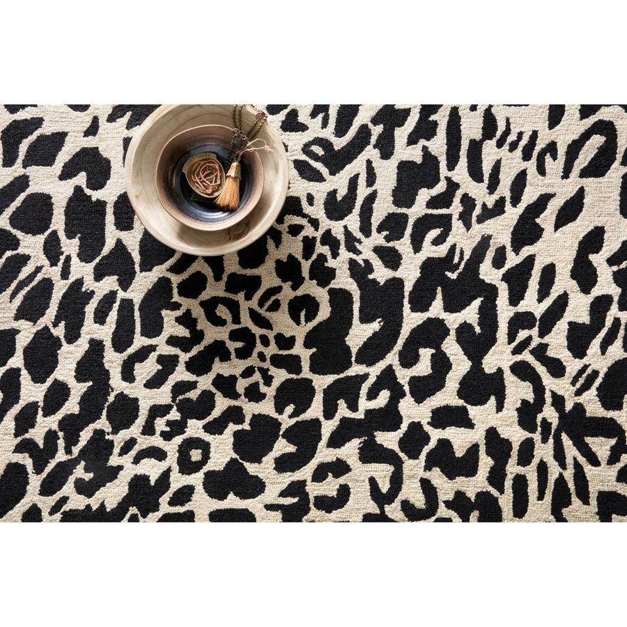 Masai Black/Ivory Rug - Amethyst Home Hooked of 100% wool, this Masai Collection is a softer side of the savannah brought to life by artisans in India. Masai is a beautiful contemporary rug with contrasting hues and is a chic twist on the classic animal print.