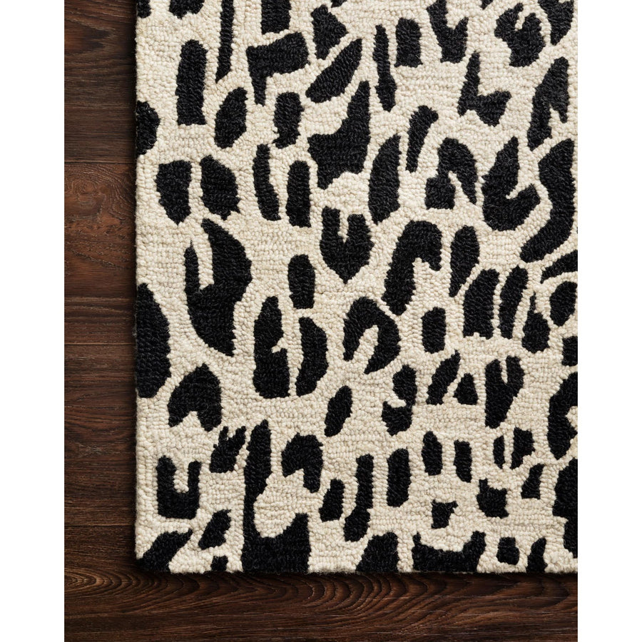 Masai Black/Ivory Rug - Amethyst Home Hooked of 100% wool, this Masai Collection is a softer side of the savannah brought to life by artisans in India. Masai is a beautiful contemporary rug with contrasting hues and is a chic twist on the classic animal print.