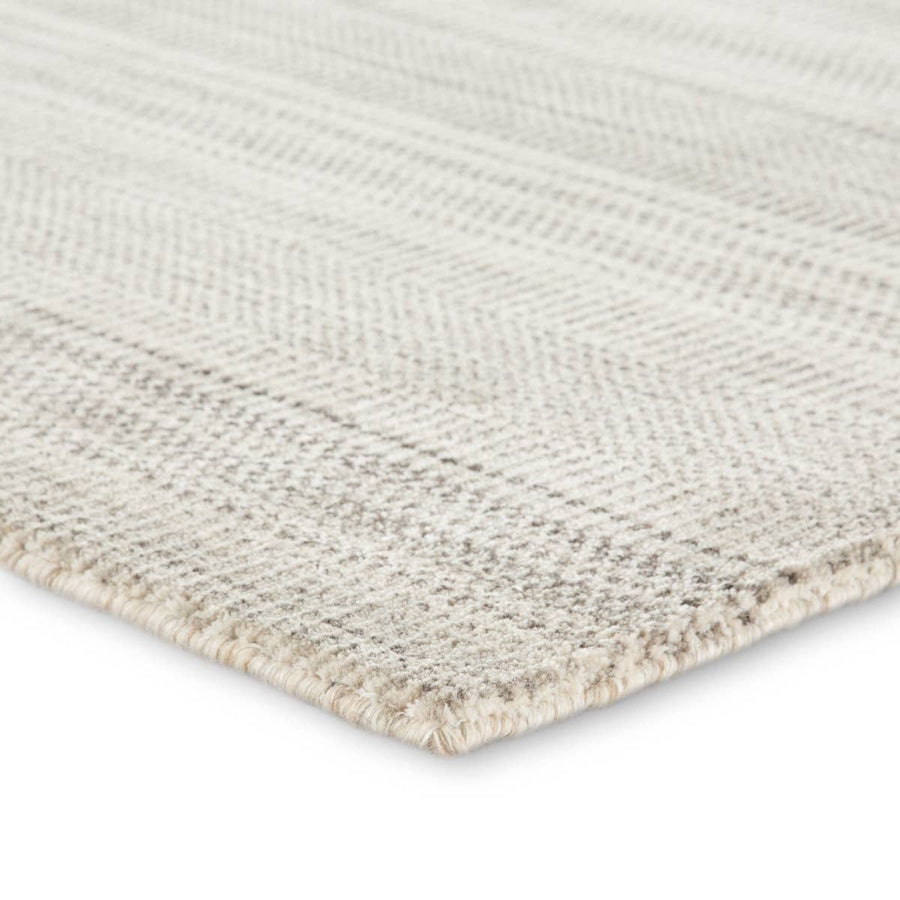 The Minuit area rug from the Trendier collection brings dimension to any room with a finely detailed pattern in variegated neutral colorway.  Soft to the touch, this hand-loomed wool and viscose accent effortlessly blends inviting texture and a timeless design. This rug is ideal for bedrooms, dining rooms, or any room you want to be more cozy and comfortable!  Hand Loomed 80% Wool | 20% Viscose TEI01