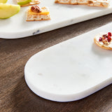 Sleek and simple, this set of oval marble trays are a great addition to any kitchen. An elegant way to serve guests an array of cheese, crackers & fruit. Amethyst Home provides interior design, new construction, custom furniture, and area rugs in the Tampa metro area.