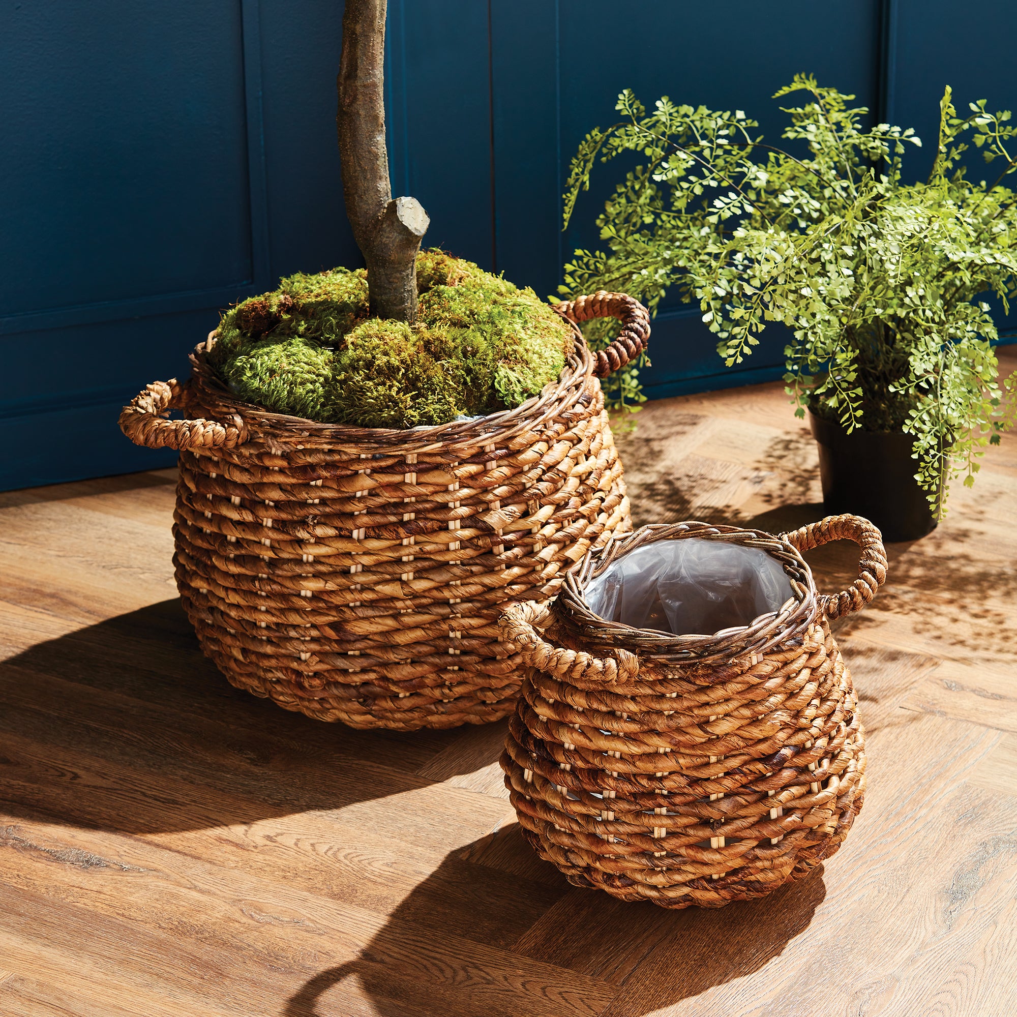A natural leaf fiber, abaca is an upcycled, sustainable material. A very durable fiber, these natural baskets are lined with plastic and great for planting. Amethyst Home provides interior design, new construction, custom furniture, and area rugs in the Boston metro area.
