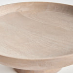 Contemporary and uniquely designed, this footed bowl is made of mango wood. Makes a beautiful serving bowl for dry foods, as well as a gorgeous centerpiece all on its own. Amethyst Home provides interior design, new construction, custom furniture, and area rugs in the Los Angeles metro area.