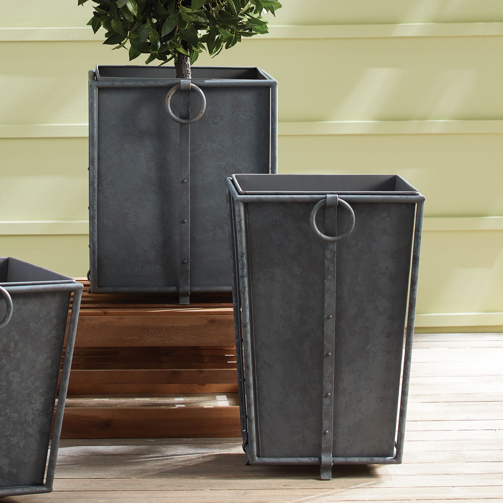 With metal liners that easily slide out, the Callahan Square Planter is as practical as it is handsome. The rounded handles and traditional design make it an outdoor classic. Amethyst Home provides interior design, new construction, custom furniture, and area rugs in the Washington metro area.