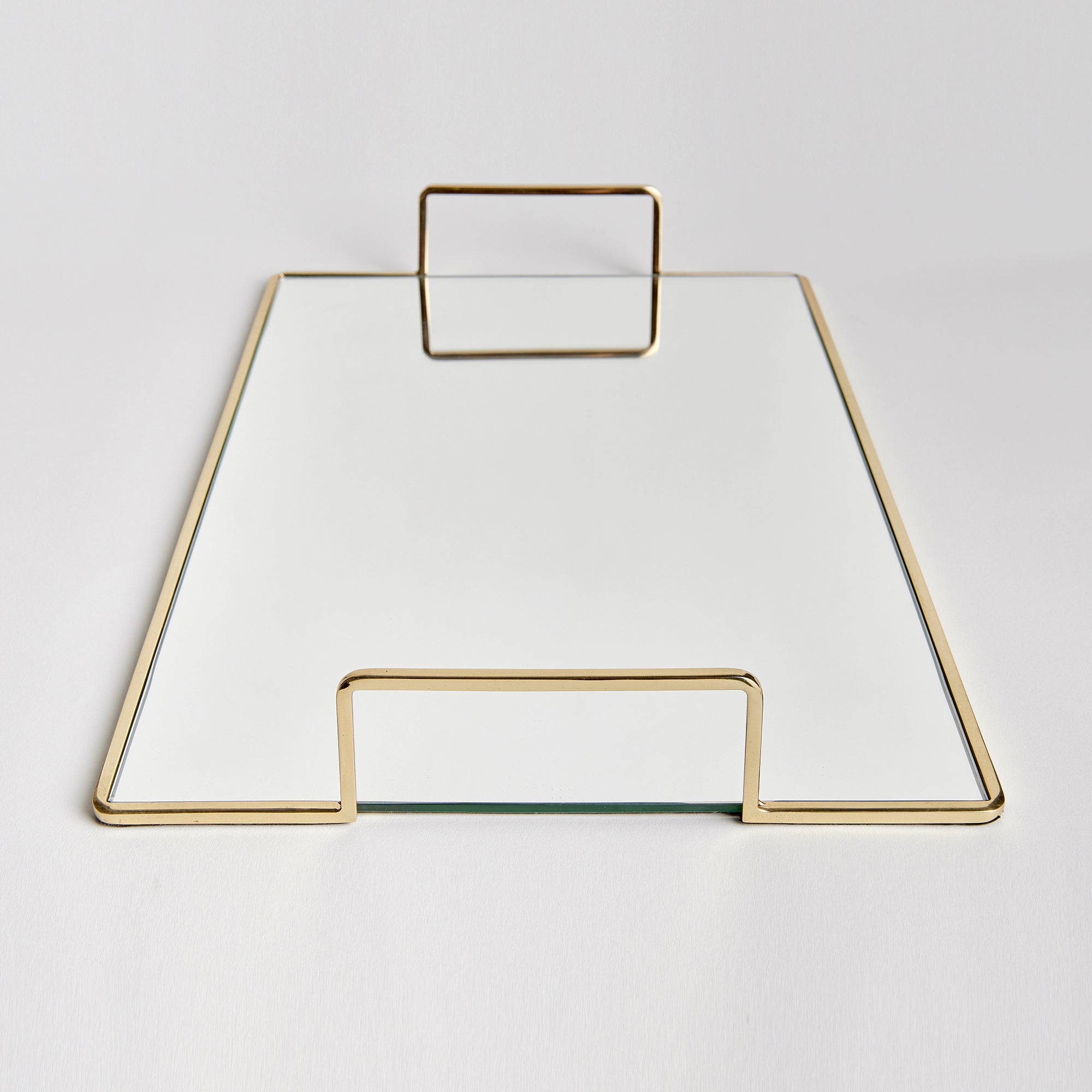 Smooth and streamlined, this mirrored tray is a clean and modern accent. Add to ottoman, side table or even the kitchen counter for a sleek look. Amethyst Home provides interior design, new construction, custom furniture, and area rugs in the Omaha metro area.