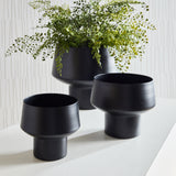 You'd never guess this set of three sleek cachepots are made of a light aluminum. Finished in a matte black, they are a contemporary set for your favorite faux ferns or floral drop-ins. Amethyst Home provides interior design, new construction, custom furniture, and area rugs in the Newport Beach metro area.