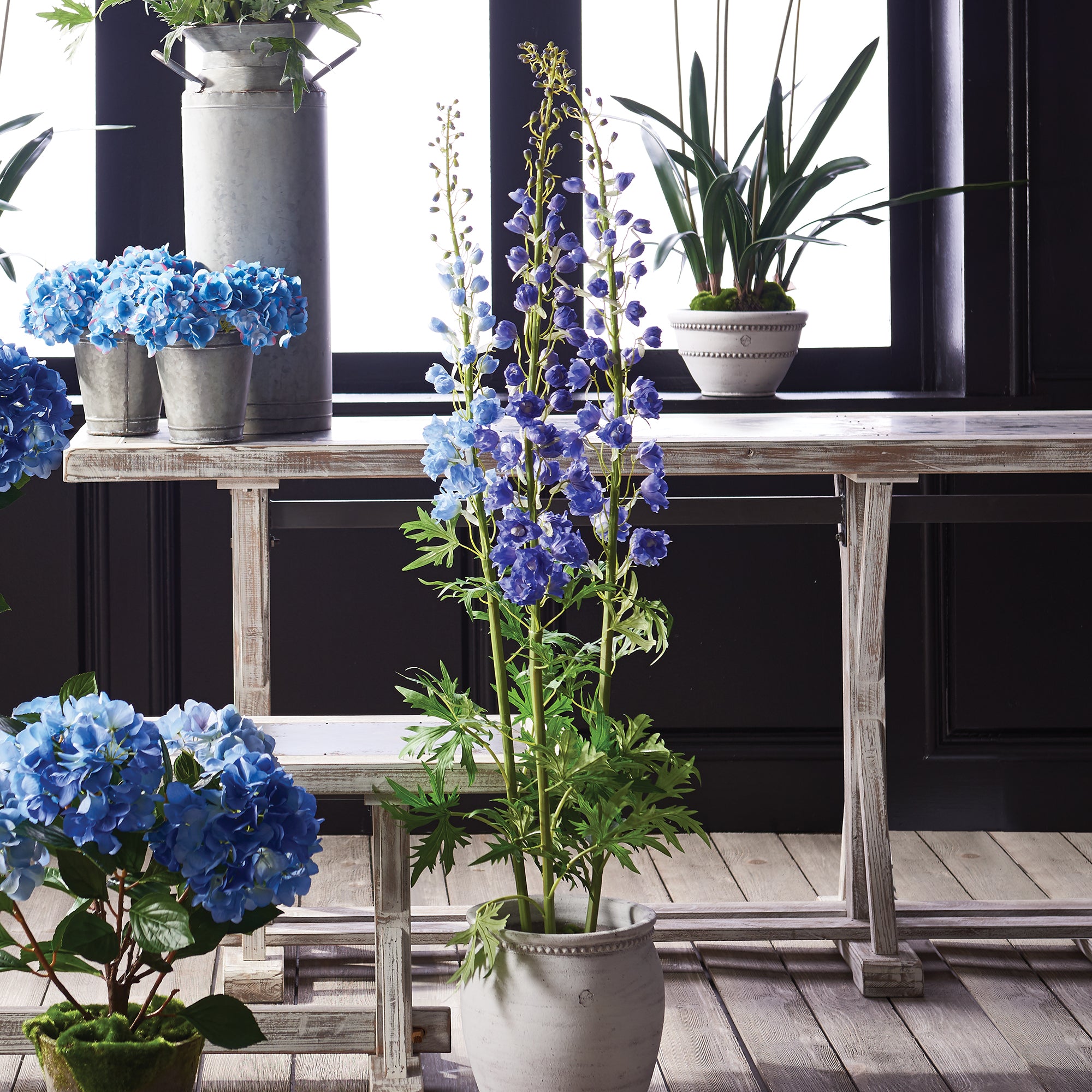 Florals are an essential design element. If done right, they can make all the difference. These potted Delphiniums add height and soothing pop of violet to any space. Amethyst Home provides interior design, new construction, custom furniture, and area rugs in the Park City metro area.
