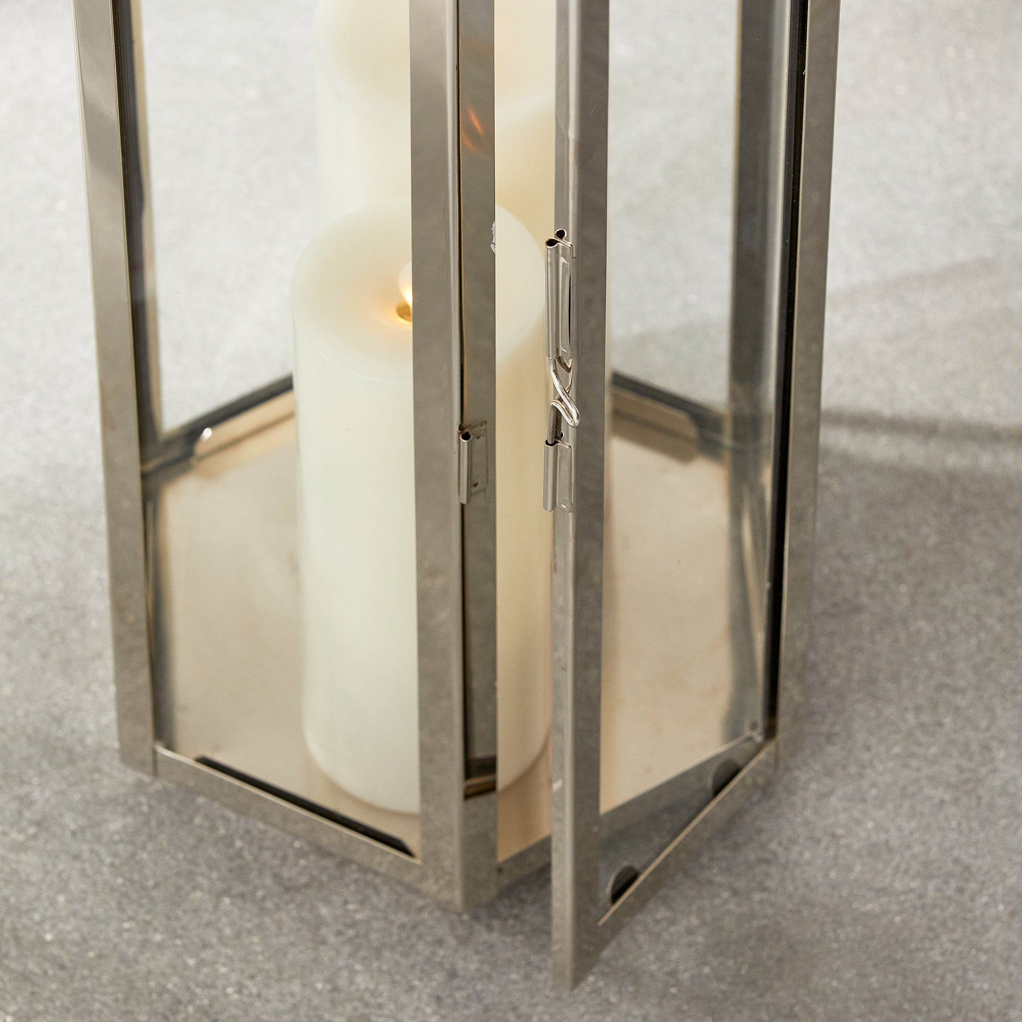 This six panel lantern is made of stainless steel and natural teak handles. Impressive in scale, it is a great accent along the mantle, or on an entry console. Amethyst Home provides interior design, new construction, custom furniture, and area rugs in the Washington metro area.