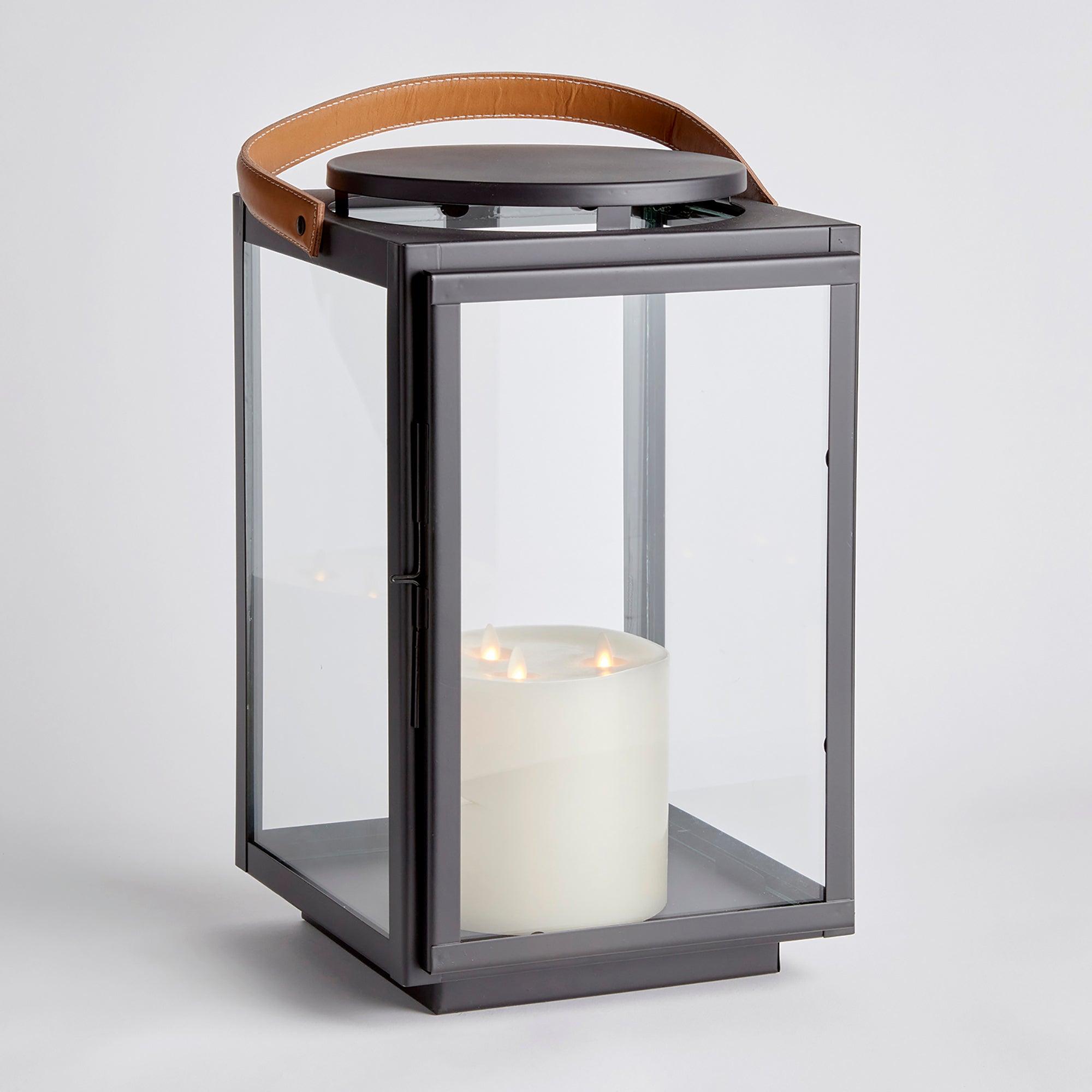 Featuring a real leather handle with tailored stitching, this well-scaled lantern is a mix of traditional and modern aesthetics. A beautiful accent for entryway, living room or study. Amethyst Home provides interior design, new construction, custom furniture, and area rugs in the Houston metro area.