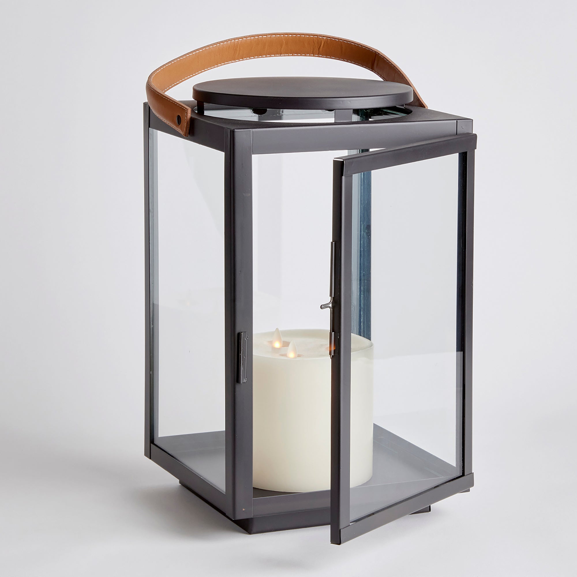 Featuring a real leather handle with tailored stitching, this well-scaled lantern is a mix of traditional and modern aesthetics. A beautiful accent for entryway, living room or study. Amethyst Home provides interior design, new construction, custom furniture, and area rugs in the San Diego metro area.