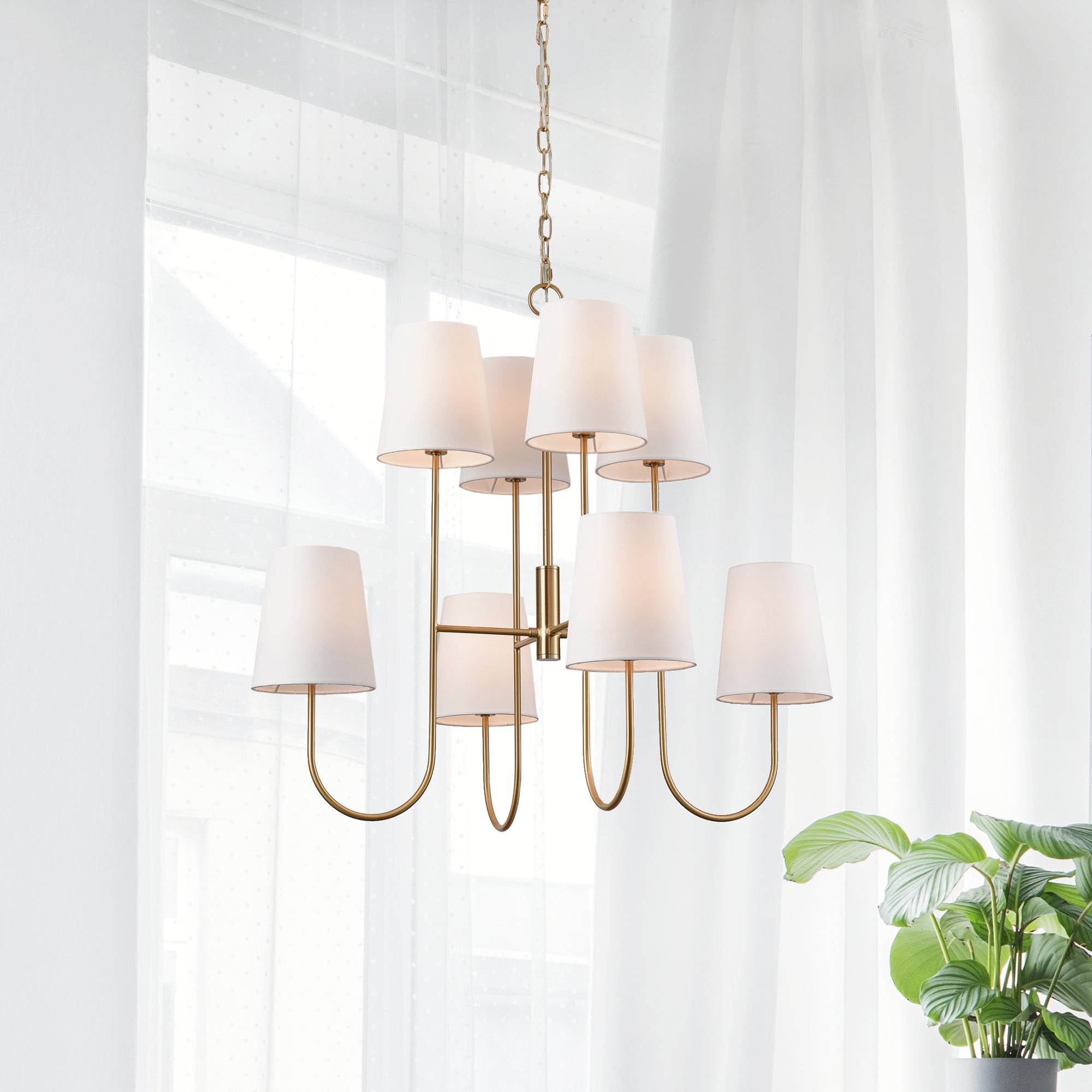 The Kinley Chandelier is a fresh take on a classic two-tiered shape. Subtle modern touches like the tapered shade and gold finish complete the look. Amethyst Home provides interior design, new construction, custom furniture, and area rugs in the Scottsdale metro area.