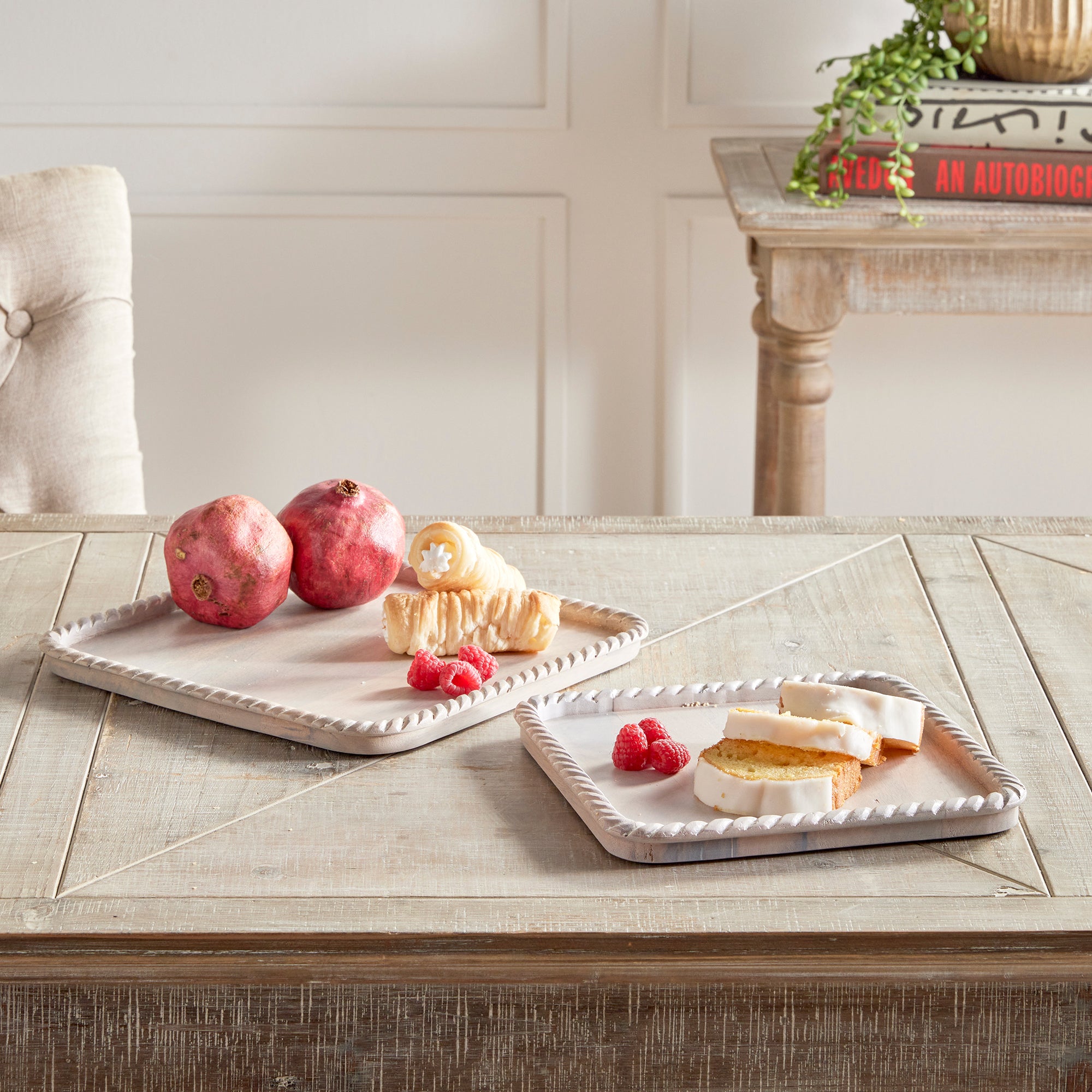 Hand carved from mango wood, this pair of trays is a sweet little accent for baked goods or a cheese tray. A little touch of natural wood tone is always on trend. Amethyst Home provides interior design, new construction, custom furniture, and area rugs in the Alpharetta metro area.
