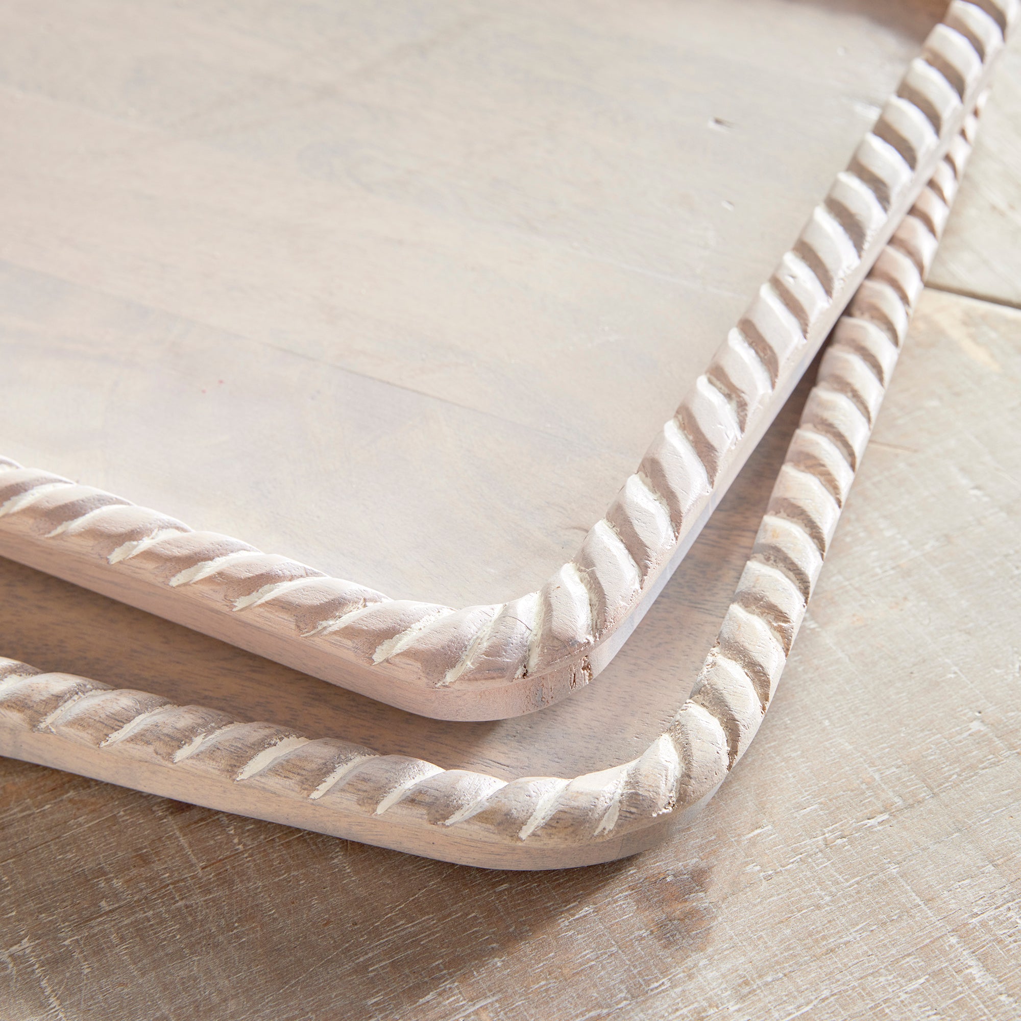 Hand carved from mango wood, this pair of trays is a sweet little accent for baked goods or a cheese tray. A little touch of natural wood tone is always on trend. Amethyst Home provides interior design, new construction, custom furniture, and area rugs in the Charlotte metro area.