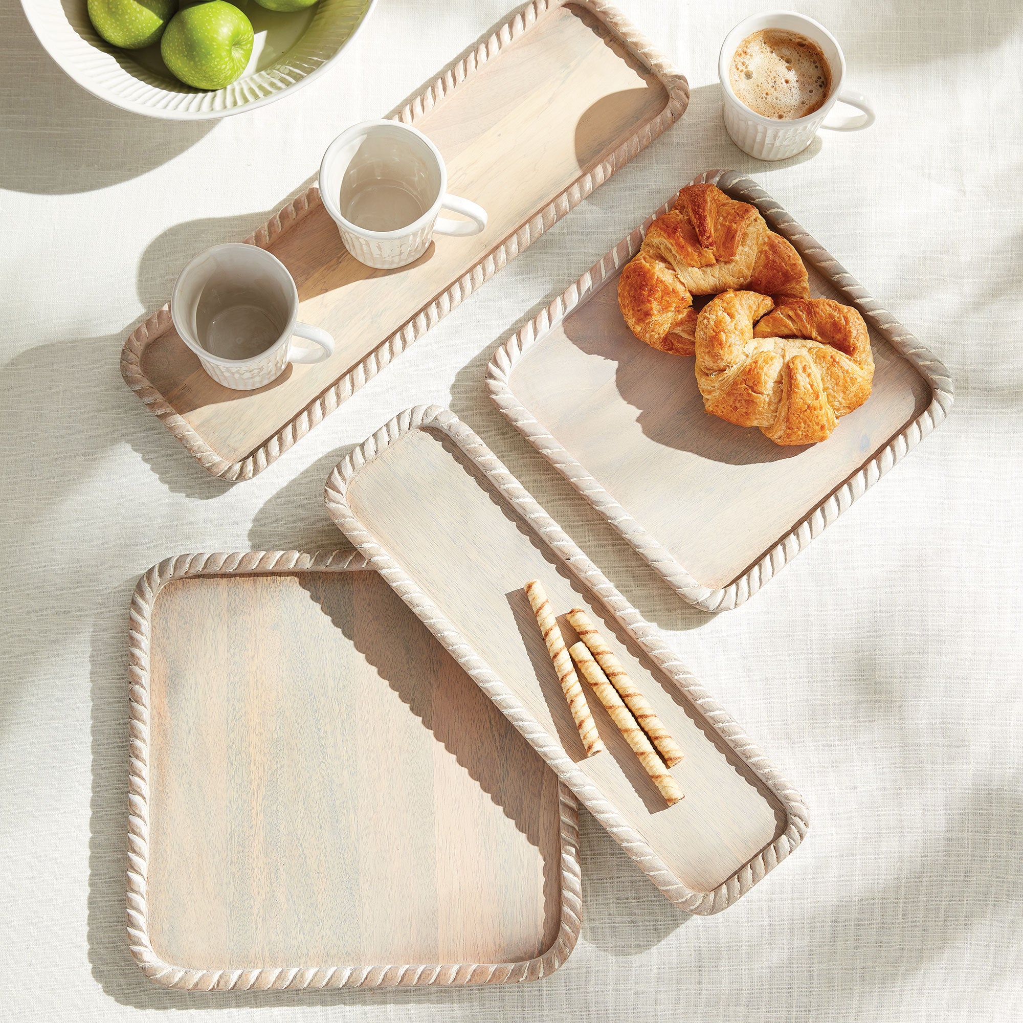 Hand carved from mango wood, this pair of trays is a sweet little accent for baked goods or a cheese tray. A little touch of natural wood tone is always on trend. Amethyst Home provides interior design, new construction, custom furniture, and area rugs in the Winter Garden metro area.