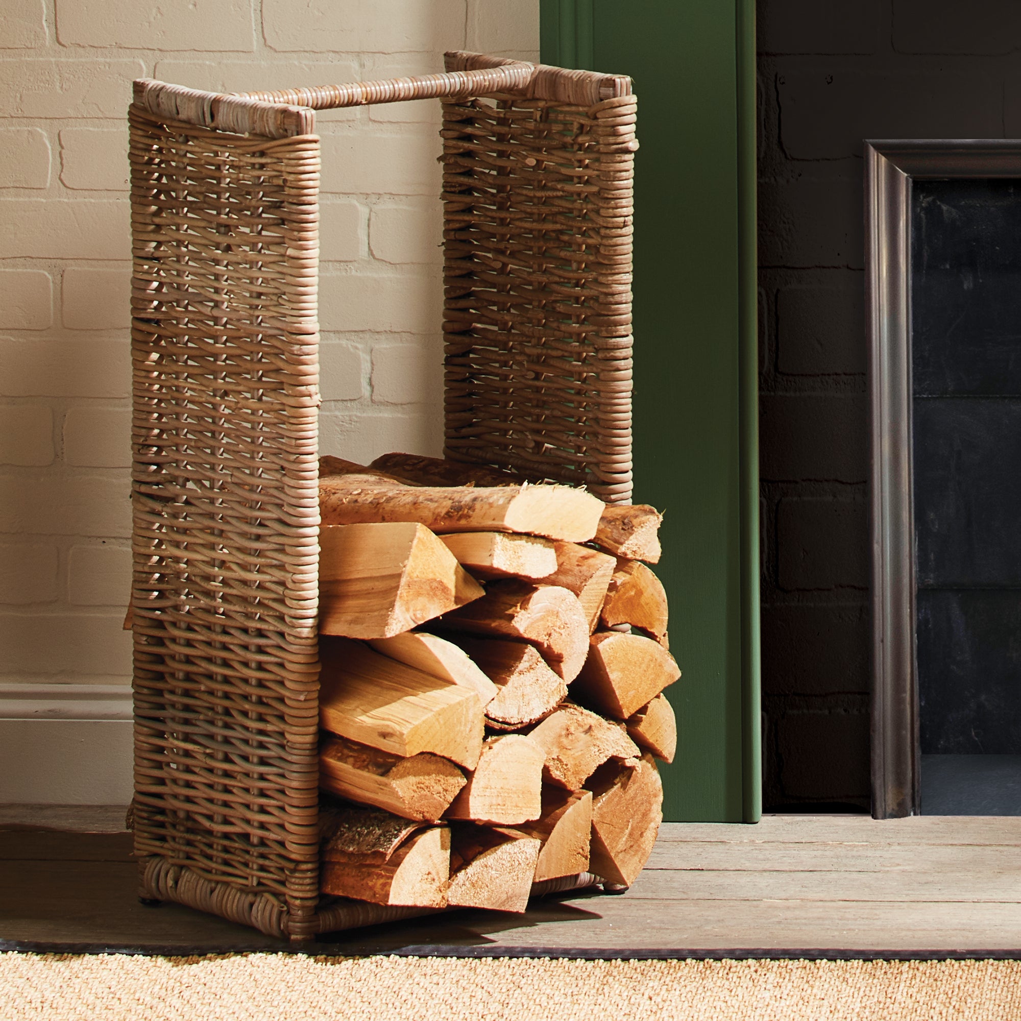 The tall, structured shape of this basket is ideal for the stack of painstakingly chopped wood logs. Place next to the hearth for a stylish, functional accent. Amethyst Home provides interior design, new construction, custom furniture, and area rugs in the Kansas City metro area.