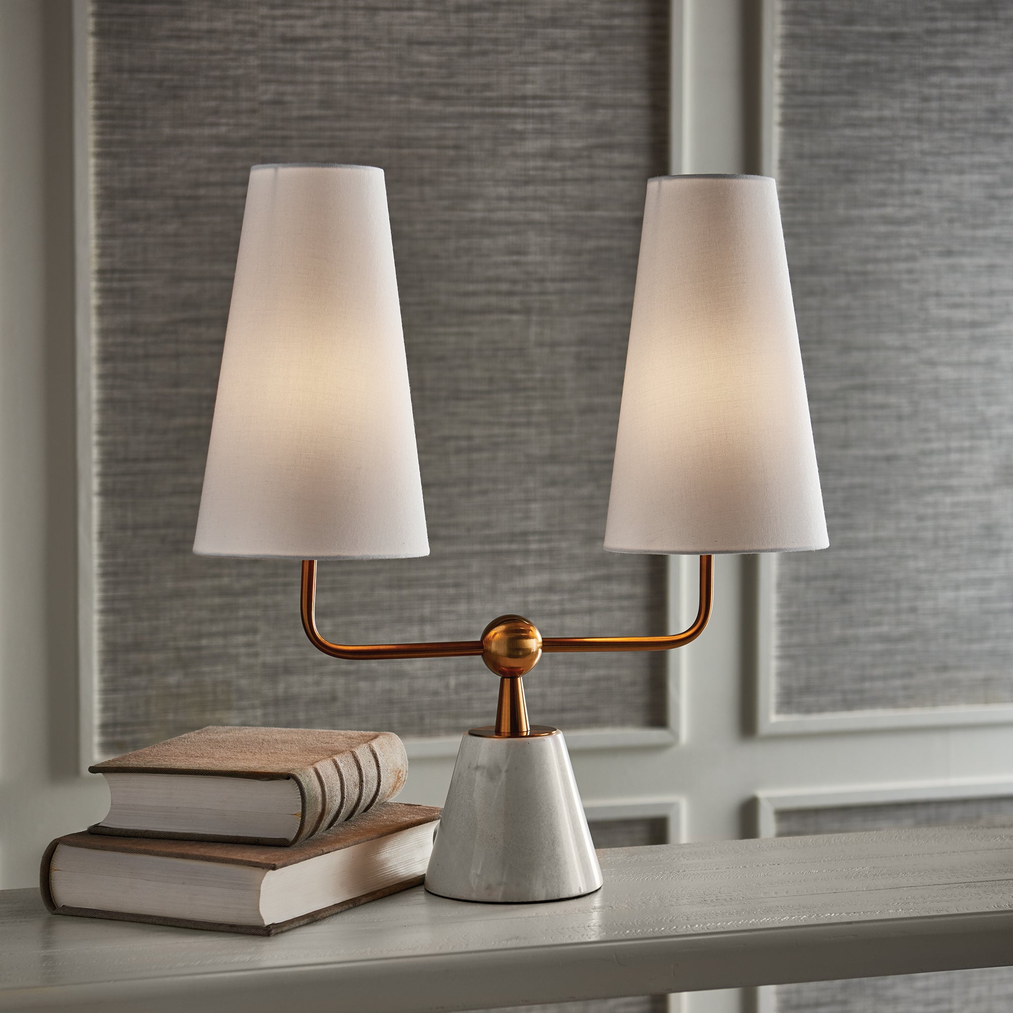 With dramatically elongated shades, the Madison Dublet Lamp is clean and modern. The brass finish and marble base give it a touch of classic elegance. Amethyst Home provides interior design, new construction, custom furniture, and area rugs in the Winter Garden metro area.