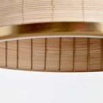 Woven in a natural cane rattan, with subtle variations in color making each one truly unique, this pendant is an instant classic. The brass details on the top and along the bottom rim make it decidedly more refined. And talk about scale! A show-stopping fixture for kitchen island, entry foyer or hallway. Amethyst Home provides interior design, new construction, custom furniture, and area rugs in the Houston metro area.