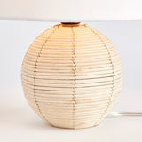 Woven in a natural cane rattan, with subtle variations in color making each one truly unique, this mini lamp is an instant classic. The petite shape and tailored shade make it the ideal lamp for kitchen counter or small workspace. Amethyst Home provides interior design, new construction, custom furniture, and area rugs in the Washington metro area.