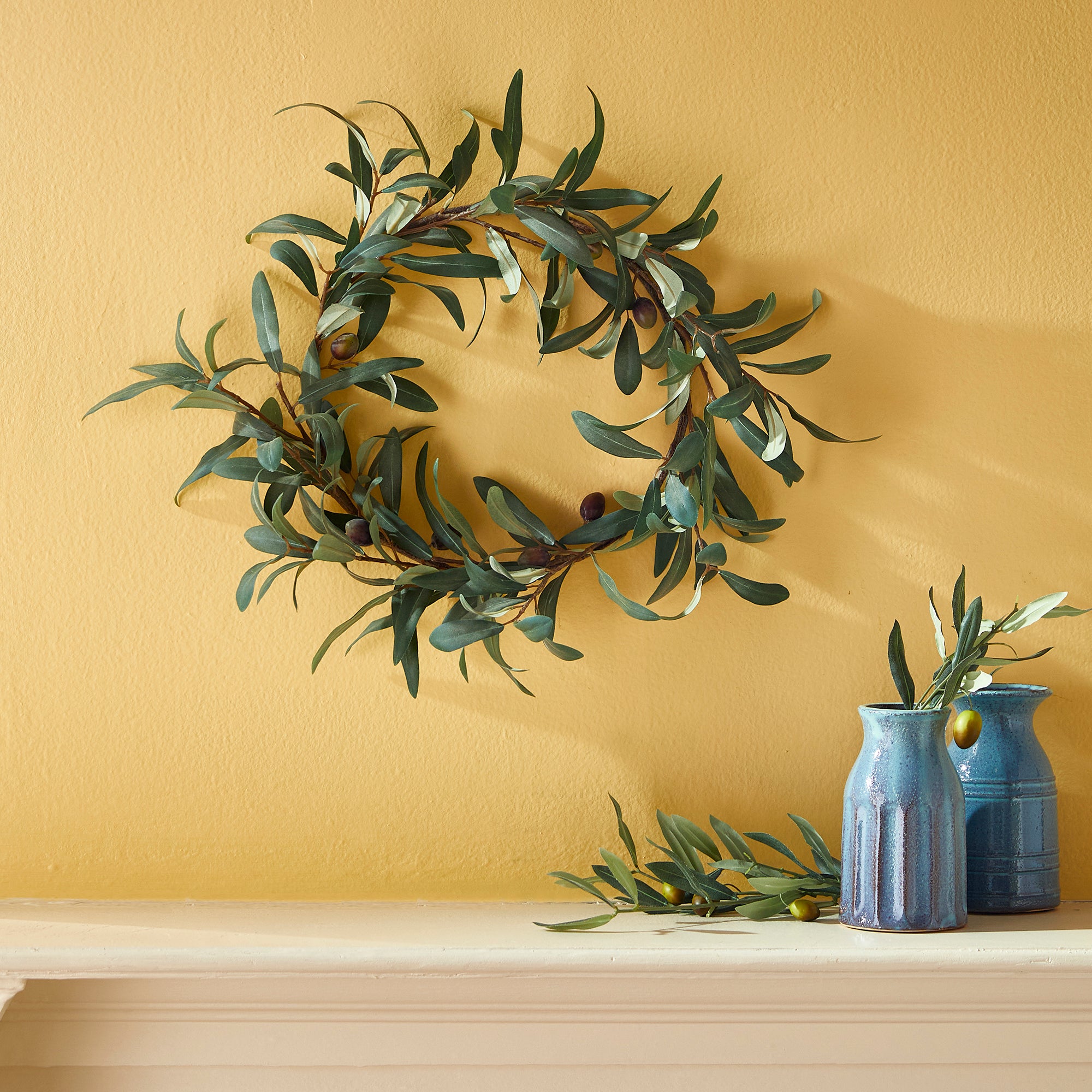 The olive wreath is a charming accent for any space needing a touch of warmth. Distinctive and refined, it's no wonder this Mediterranean beauty has stood the test of time. Amethyst Home provides interior design, new construction, custom furniture, and area rugs in the Kansas City metro area.