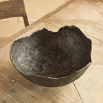 This decorative hand-sculpted bowl is made to be on display. With an oil-rubbed bronze finish and irregular edge, styled or just as it is, a strong statement for the modern space. The epitome of functional art. Amethyst Home provides interior design, new construction, custom furniture, and area rugs in the Miami metro area.