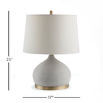 An unexpected mix of cement and brass accents make the Suki lamp a stand out fixture. Extra curvy base and wide shade are details that add style and personality. Amethyst Home provides interior design, new construction, custom furniture, and area rugs in the Calabasas metro area.