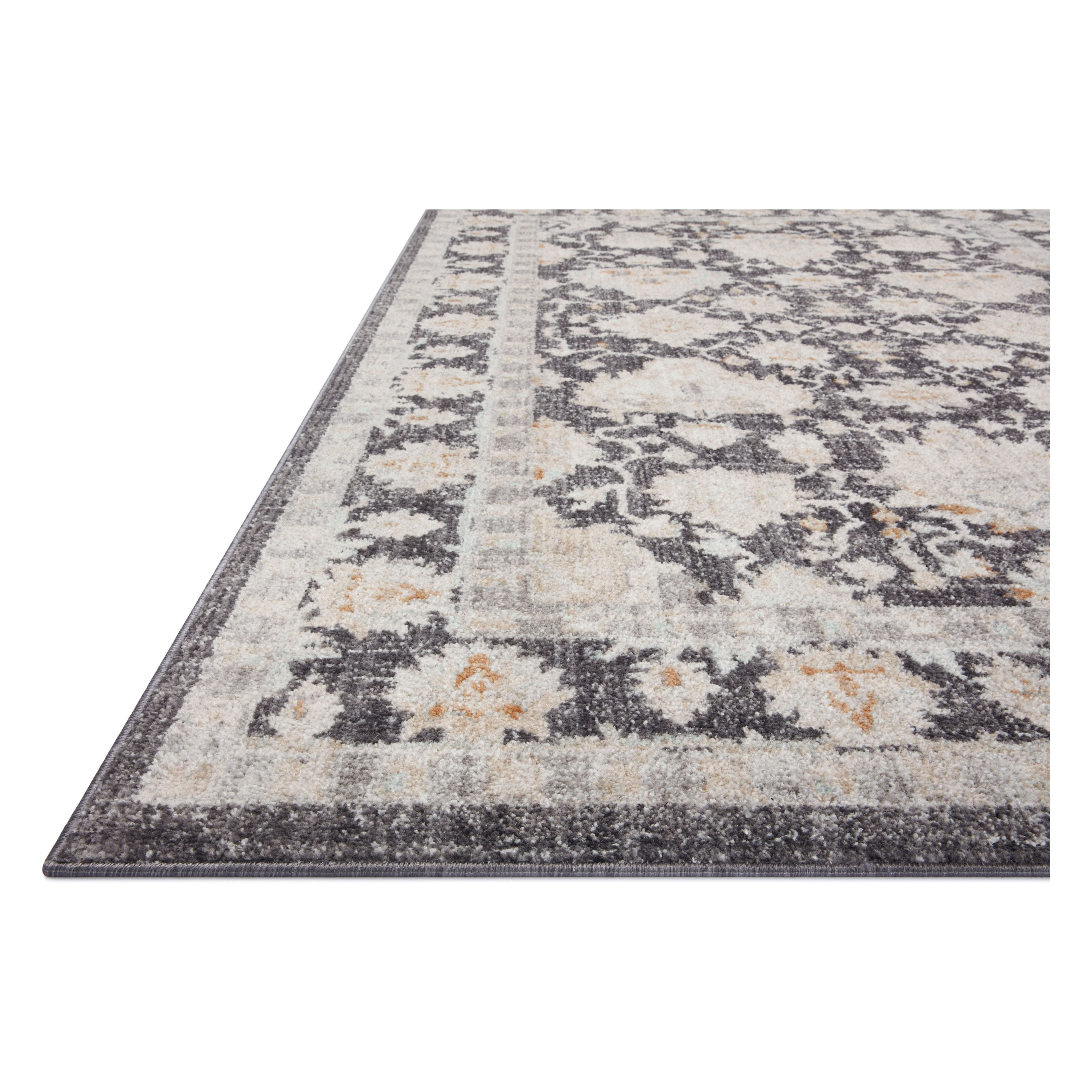 Inspired by antique Turkish Oushak carpets with large-scale motifs, the Monroe Charcoal / Natural Rug modernizes the traditional design in neutral palettes, many of which have black details that anchor the rug in the room. Monroe is power-loomed of 100% polypropylene for easy care and reliable durability. Amethyst Home provides interior design, new construction, custom furniture, and area rugs in the Salt Lake City metro area.