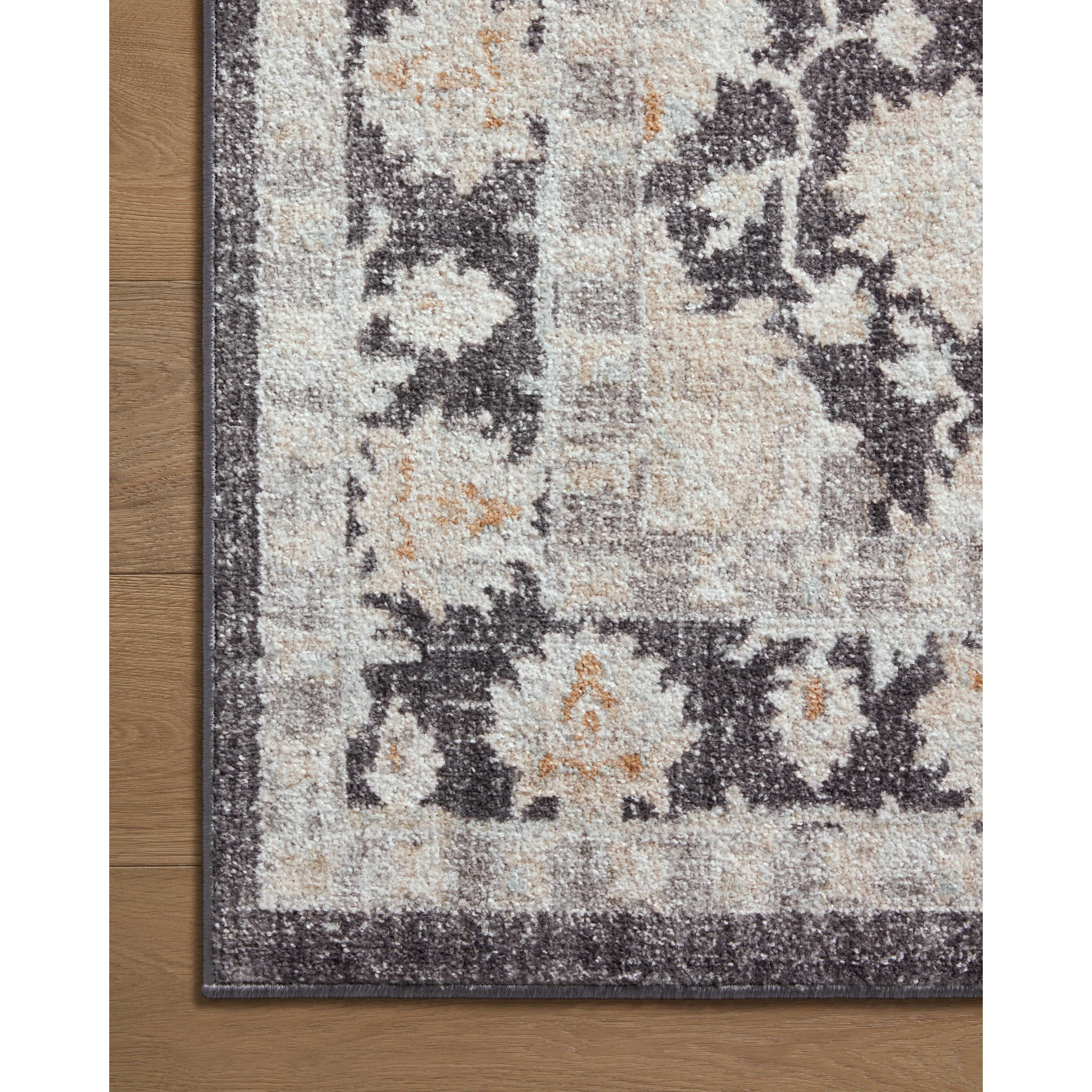 Inspired by antique Turkish Oushak carpets with large-scale motifs, the Monroe Charcoal / Natural Rug modernizes the traditional design in neutral palettes, many of which have black details that anchor the rug in the room. Monroe is power-loomed of 100% polypropylene for easy care and reliable durability. Amethyst Home provides interior design, new construction, custom furniture, and area rugs in the Scottsdale metro area.