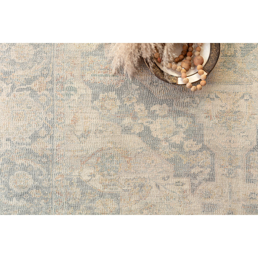 Hand-woven by skilled artisans, the Priya Bone / Bluestone Area Rug from Loloi offers beautiful tonal designs accentuated by a carefully curated color palette in tones of blue, orange, and beige. Delicate yet strong, the Priya is blended with wool, cotton, and more and an instant classic made for today's home.