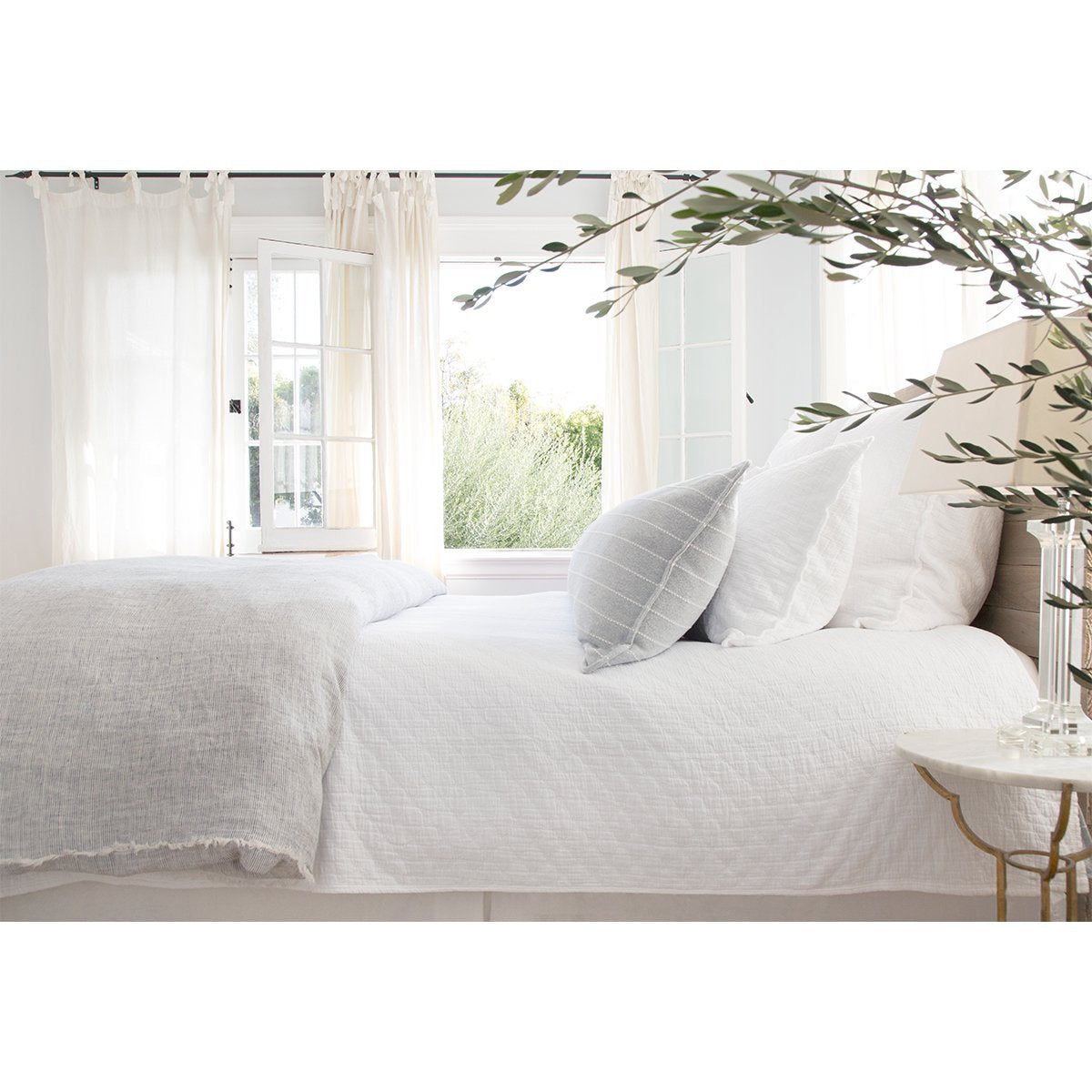 Crafted in Portugal, the Ojai matelasse by Pom Pom at Home is light and casual, bringing comfort with its subtle diamond pattern. The coziest bedding to climb into after a long day.   100% cotton. Machine wash cold; tumble dry low; warm iron as needed. Do not bleach 